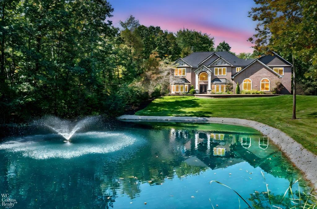 Incredible opportunity to own a private country estate on nearly 12 wooded acres! This spacious home offers over 4,100 sq. ft. of living space with a thoughtful floor plan ideal for entertaining and everyday living. Main level highlights include 9' ceilings throughout, a welcoming living room, formal dining room, and a family room with a two-way fireplace with kitchen. The kitchen is well-appointed with granite counters, center island, and hardwood floors and a 12x16 screened porch off eating area. Upstairs, the expansive primary suite features a private bath and walk-in closet and a 5x14 screened in porch. A large bonus room (currently used as an exercise room), three additional bedrooms, and a convenient second-floor laundry complete the upper level. The beautifully finished walkout lower level adds even more living space with a recreation room, wet bar, 4 large utility/storage rooms, and access to a lower level garage/workshop. An attached 1810 sq. ft. heated 3-car garage provides plenty of parking and storage. Exterior features include a full composite deck, an upper-level screened porch, and steps leading to a partial inground 40x20x52 swimming pool and firepit. The property also offers a scenic pond and 11+ wooded acres with approximate 1.25 miles of atv/walking trails-perfect for outdoor enjoyment and year-round relaxation. Utility features include  2x6 construction,3 furnaces, 2 a/c units, 23kw whole house generator, 300 kw electric service, 2 electric panels sprinkling system, security system See attachments for list of inclusions in this beautiful home