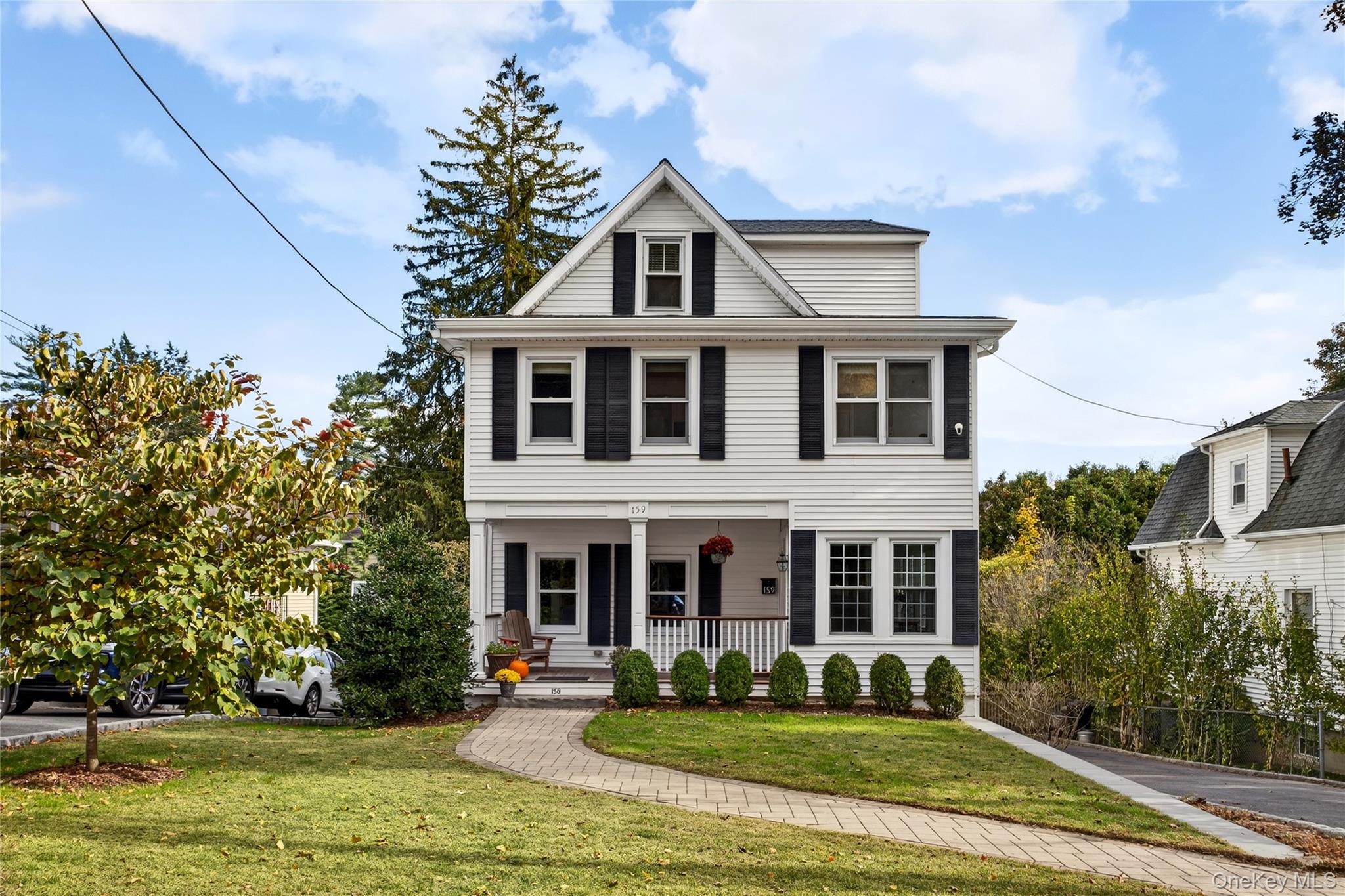 Welcome to this beautifully maintained Colonial, ideally located just moments from the vibrant village of Pleasantville. This prime location offers seamless access to town life—enjoy weekend strolls to the acclaimed Farmer’s Market, top-rated dining, boutique shopping, and cultural attractions. Commuting is simple and stress-free with the Metro-North train station just a short walk away.

Inside, you'll find light-filled, open-concept living and dining spaces that create a warm and inviting atmosphere, perfect for both everyday living and entertaining. The main floor includes a convenient powder room for guests. Upstairs, the spacious primary bedroom features an en suite bath, while a second comfortable bedroom and a full hall bathroom complete the upper level. Throughout the home, timeless built-ins add charm, character, and smart storage.

Recent updates include a new roof and a newly built back deck with easy access from the main level. The deck leads directly to a fenced-in backyard, ideal for play, pets, or outdoor gatherings. The home also includes an EV charger, offering convenient at-home electric vehicle charging along with a generator hookup to ensure peace of mind during power outages.

The lower level provides direct backyard access and features a versatile recreation space along with a quiet office area, perfect for remote work or study. This move-in ready home blends classic charm with modern updates, making it a perfect match for those looking to enjoy their new place from day one.