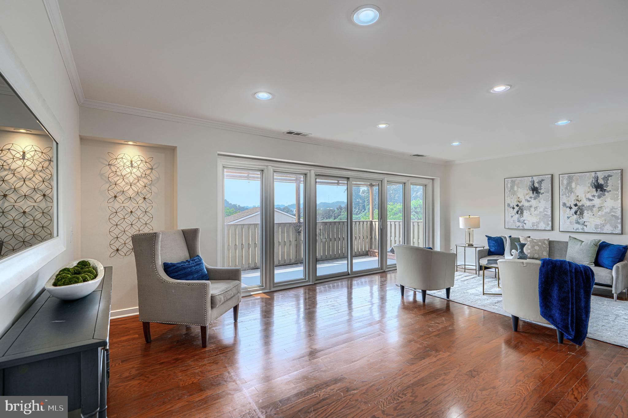 Discover the perfect blend of comfort, convenience, and value in this meticulously maintained, move-in ready 2 bedroom, 1.5 bath corner condominium located in the highly sought-after gated Cross Keys community, one of Baltimore’s premier destinations for low-maintenance living. This pet-friendly condo community offers an exceptional lifestyle with thoughtfully designed amenities, beautifully landscaped grounds, and a welcoming neighborhood atmosphere.  A dramatic wall of windows fills the home with abundant natural light, creating a bright and inviting atmosphere throughout the spacious living and dining areas. Step outside to enjoy your own covered balcony, the perfect spot for morning coffee, relaxing, or taking in the peaceful surroundings. Beautiful wood floors, generous walk-in closets, and a thoughtfully designed floor plan provide both style and everyday functionality. This sun-filled corner residence showcases pride of ownership and offers the comfort of a turnkey home in Baltimore. Enjoy the convenience of covered parking and the exceptional value of a condo fee that includes all utilities, providing predictable monthly expenses and effortless homeownership. Whether you are a first-time buyer, downsizing, or seeking a convenient lock-and-leave lifestyle, this low-maintenance condo offers the features today's buyers are searching for.  Cross Keys offers an exceptional community experience with a beautifully landscaped, gated setting, scenic walking trails, a community swimming pool, and a vibrant walkable neighborhood just steps from boutique shopping, restaurants, cafés, and everyday conveniences. Residents enjoy the perfect balance of peaceful surroundings, outdoor amenities, and urban accessibility.  Ideally located with convenient access to downtown Baltimore, Johns Hopkins, major commuter routes, and nearby attractions, this desirable Cross Keys residence offers an outstanding combination of location, amenities, and value. If you are searching for a Baltimore City condo with a covered balcony, covered parking, all utilities included, abundant natural light, pet-friendly living, and resort-style community amenities, this exceptional corner condominium delivers the lifestyle and convenience you have been looking for.