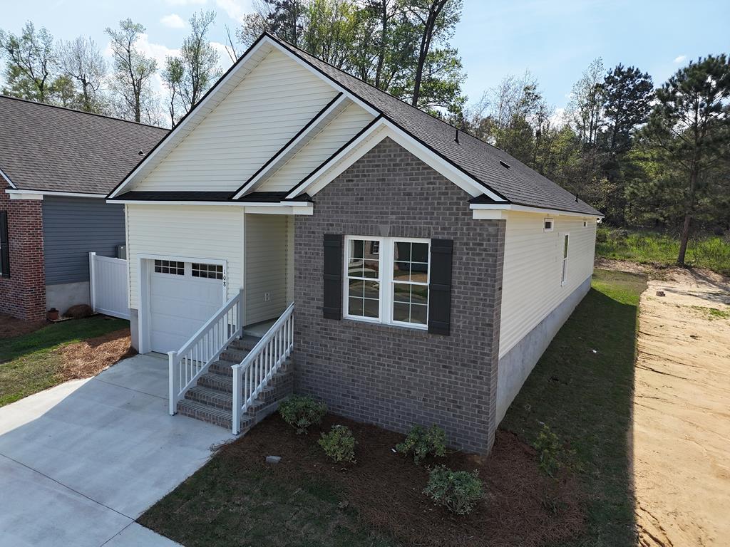 NOW COMPLETE! Ready to move in! This home was listed prior to completion but is now finished and ready! Covered porch, plus Patio for enjoying pleasant weather morning and evening in beautiful Thomasville. Newly constructed and near everything, including shopping, eating, walking and more! Will be ready soon!  Spacious single family cottage home in the desirable 55 and older Huntington Pointe Subdivision. 3 bedrooms and two baths with an enormous great room with vaulted ceiling and spacious bar separating the large kitchen filled with cabinets. Garage for safety and privacy. Lovely landscaped yard. Lots of quality extras inside this new construction home. Many want this quiet area but desire a single family home, here it is! Completion date expected October 2025