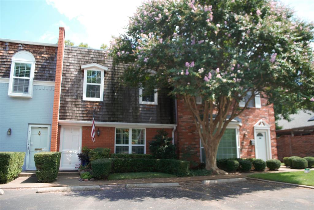 Exquisite 2-story Condo located in the gated community of Indian Creek with convenient access to the Cultural District and Downtown. Enter past the well-manicured front to an open floor plan, including a coat closet and half bath, into Front Living or Home Office featuring plantation shutters. Step-down into rear Living featuring a wood-burning fireplace and double-French doors, opening onto a private, brick and wood fenced, patio, accented with turf and flagstone. Kitchen exhibits a pass-through and breakfast bar; ceramic tile flooring; granite countertops; and stainless appliances, with built-in microwave drawer. Upstairs offers two spacious Bedrooms each with private baths, as well as a full-size washer and dryer closet. Primary Suite features a double closet with built-ins; a French door to balcony, and bath with tile vanity, double sinks, and walk-in glass front, tiled, shower. The spacious Guest Suit offers a double closet and shadow-box window. To see is to believe.