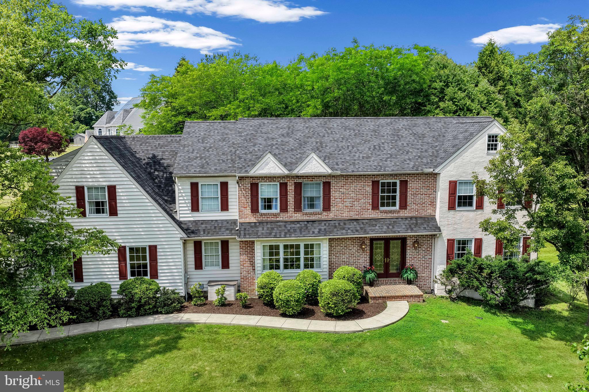 Welcome to 114 Aspen Drive, an extraordinary estate nestled on 2 acres in one of Downingtown’s most desirable settings. Offering 4 bedrooms, 3.5 bathrooms, and 4,742 square feet of beautifully designed living space, this exceptional home blends timeless elegance with the comfort and functionality today’s buyers are seeking. A grand two-story foyer welcomes you inside, where abundant natural light, soaring ceilings, and refined finishes create an immediate sense of warmth and sophistication. Designed for both everyday living and effortless entertaining, the main level features gracious formal living and dining rooms, perfect for hosting everything from intimate gatherings to holiday celebrations. At the heart of the home, the gourmet kitchen is as functional as it is beautiful. Complete with a large center island, stainless steel appliances, abundant cabinetry, and generous workspace, it flows seamlessly into the breakfast area and expansive family room. Anchored by a charming wood-burning fireplace and framed by picturesque views of the property, this inviting space was designed for gathering with family and friends. Upstairs, the luxurious primary suite serves as a true private retreat. Featuring a spacious sitting area, dual walk-in closets, and a spa-inspired bath with a soaking tub, separate shower, and dual vanities, it offers the perfect place to unwind at the end of the day. Three additional generously sized bedrooms and well-appointed bathrooms provide ample space for family and guests. The lower level offers endless possibilities, whether you envision a home theater, fitness studio, recreation room, or additional living space tailored to your lifestyle. Step outside and discover your own resort-style backyard oasis. The in-ground pool, concrete patio, and beautifully landscaped grounds create an exceptional setting for summer entertaining, relaxing weekends, and unforgettable evenings under the stars. Surrounded by mature trees and open green space, the 2-acre property offers a rare sense of privacy while remaining conveniently close to everything Downingtown has to offer. Located within the award-winning Downingtown Area School District and just minutes from shopping, dining, parks, and major commuter routes, 114 Aspen Drive presents a rare opportunity to own a truly remarkable home where luxury, comfort, and location come together seamlessly. Experience the lifestyle you’ve been waiting for.