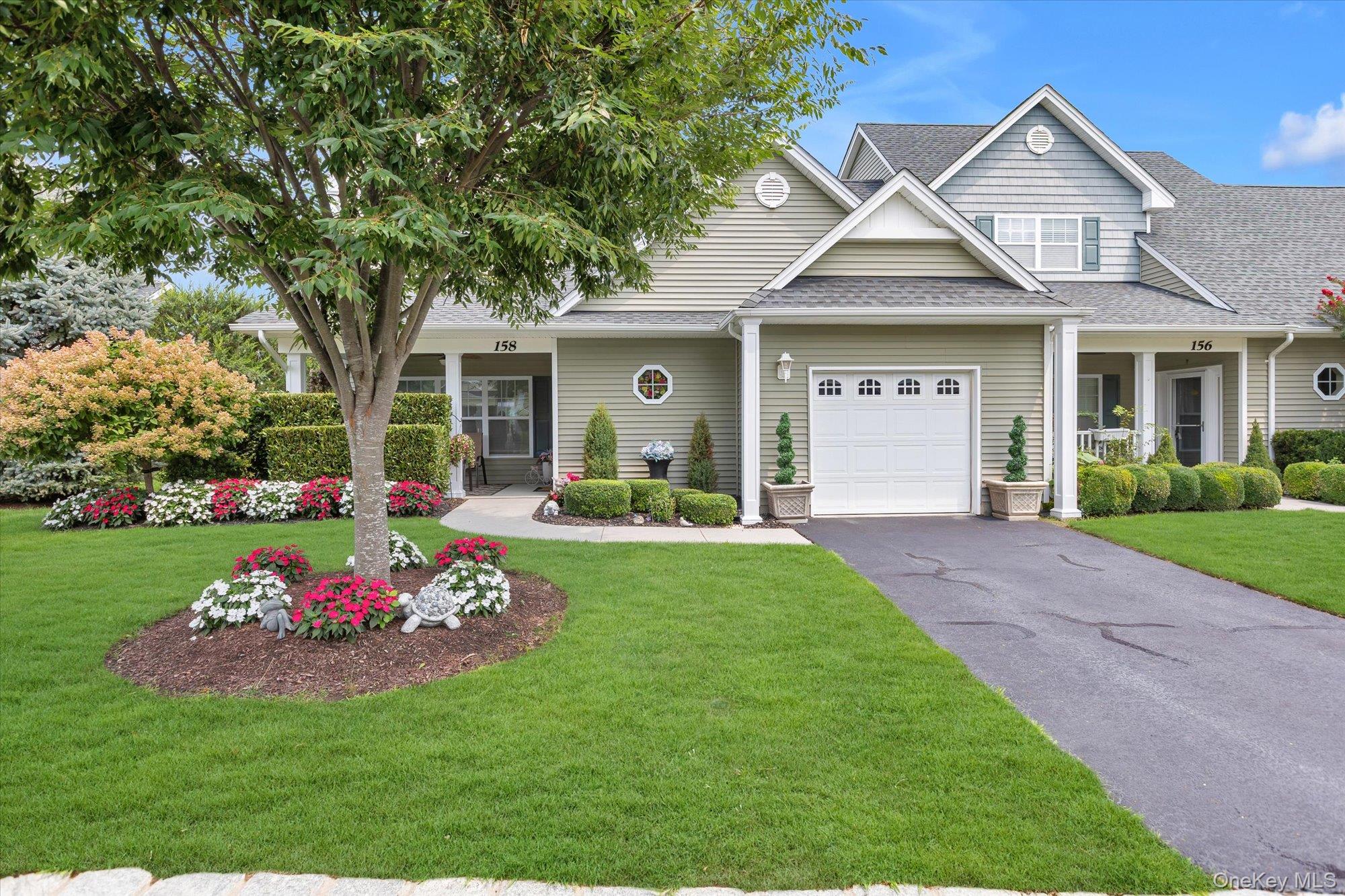 Welcome Home to Stoneleigh Woods, Riverhead's premier gated 55+ community! Rarely does a 2+bedroom end-unit Aspen Model become available. This immaculate, lightly used, and meticulously maintained residence offers 2,107 square feet of turnkey living space designed for comfort, convenience, and effortless entertaining.The sun-drenched main level features an open-concept floor plan with soaring cathedral ceilings, hardwood floors, crown molding throughout, and an abundance of natural light. The spacious living and dining areas flow seamlessly into the beautifully appointed kitchen featuring granite countertops, stainless steel appliances, ample cabinetry, and generous storage space.The primary suite serves as a private retreat, offering spacious closets and an en-suite bath with double sinks and a tiled, walk-in shower. Additional upgrades include custom-made blinds and shades, electric skylight shades, and a whole-house water filtration system, fenced in patio,1-car attached garage and ample guest parking.The second floor provides exceptional flexibility with a full bathroom, abundant closet space, and a dedicated storage room, making it ideal for another bedroom, a home office, or hobby space.Residents of Stoneleigh Woods enjoy resort-style amenities, including a beautiful clubhouse, community pool, fitness room and the security and convenience of a gated, low-maintenance lifestyle. Ideally located near farm stands, shopping, restaurants, golf courses, wineries & breweries, and all the North Fork has to offer.A rare opportunity to own one of the community's highly sought-after end-unit Aspen Models. Move right in and start enjoying the lifestyle you deserve!  Act fast.  This unit won't last!