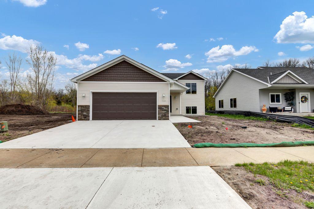 Not your typical Split Level Home! Features include High End finishings with Custom Cabinets, Granite Countertops/Vanities, Stainless Steel Appliances. Built in Linen Closets. Full Main Floor Living Area & Bathrooms have Vinyl Plank flooring. All Interior walls are insulated to reduce sound. Lower-Level utility room is finished . Garage is completely insulated and sheet rocked, drain and prewired for an electric heater.  Gutters with drain tile & Sprinkler System. Many more lots and build options available.