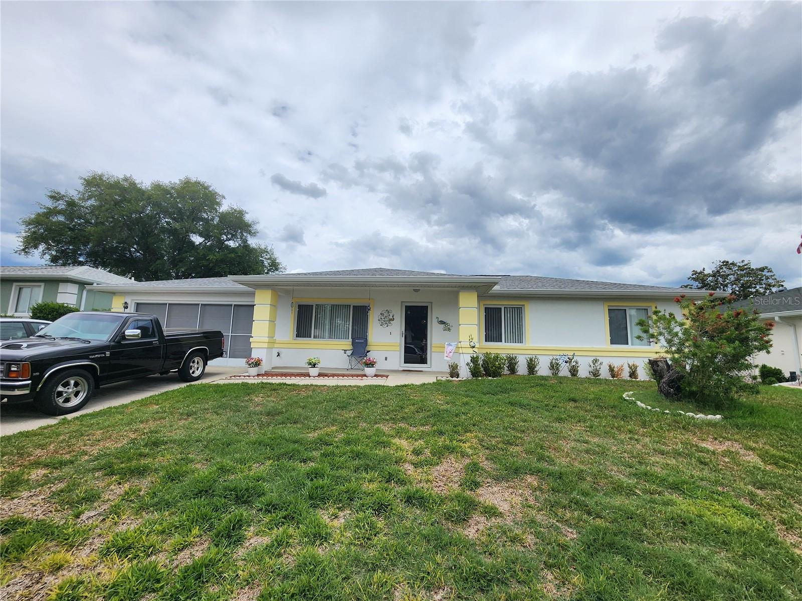 Now offering $5,000 towards closing costs. Welcome to this beautifully maintained home nestled in the highly desirable Cherrywood Estates, a vibrant 55+ community in Southwest Ocala where comfort, convenience, and lifestyle come together. This charming 2-bedroom, 2-bathroom residence offers approximately 1,300+ square feet of thoughtfully designed living space, featuring a bright and open layout enhanced by abundant natural light.The spacious living and dining areas flow seamlessly, creating the perfect setting for both relaxing and entertaining. The home features generously sized bedrooms, each with walk-in closets, providing ample storage and comfort.The kitchen was upgraded and is equipped with essential appliances and offers functional space for everyday living, while the enclosed flex room/sunroom and creates an ideal indoor-outdoor retreat—perfect for enjoying Florida’s year-round sunshine.