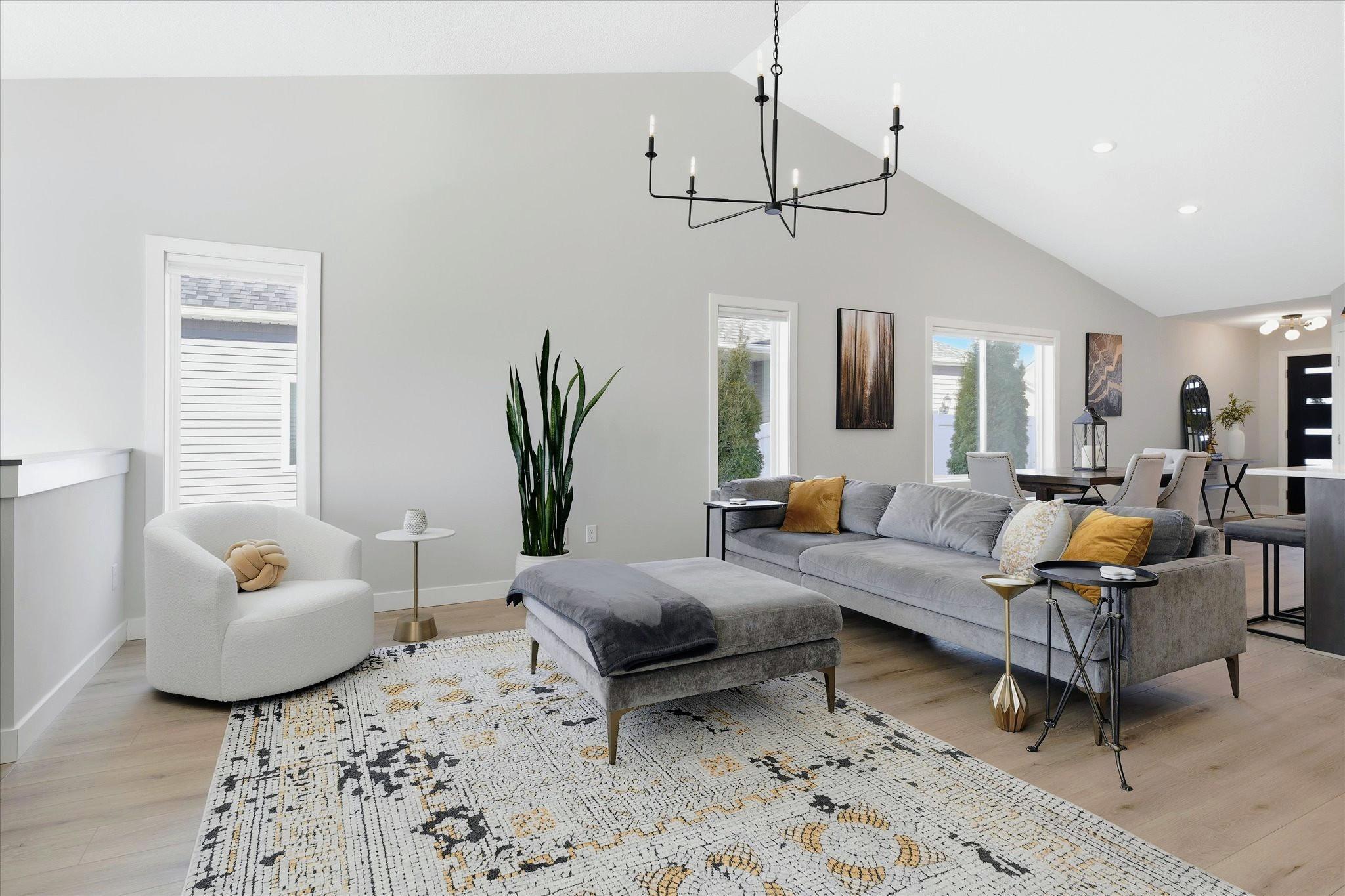 Step into a home where thoughtful design, modern comfort, and elevated style come together effortlessly. Tucked into the serene, park like setting of Highland Knolls, this beautifully upgraded single family home offers a designer lifestyle with the convenience of lawn care, snow removal, and sanitation all handled for you.Sunlight pours through expansive windows, illuminating an open floorplan enhanced by vaulted ceilings, custom trim work, and whole house luxury vinyl plank flooring. Designer lighting, removable accent wall murals, custom blinds, and a full Ring security system elevate both style and peace of mind.The kitchen is the heart of the home, blending quartz countertops, a tile backsplash, gas stove, high capacity hood, and a generous island that invites gatheringThe main floor owner’s suite feels like a private retreat with its walk in closet, custom maple storage, and spa inspired ensuite featuring a 6 foot soaking tub and walk in shower with a custom frosted door.The walkout lower level extends your living space with a cozy fireplace, two additional bedrooms, a full bath, and a flexible bonus room perfect for hobbies, fitness, or guests. Outdoor living is just as impressive. A 16×16 concrete patio, rock edging, vinyl privacy fencing, and arborvitae plantings create a welcoming backdrop for relaxation or entertaining. The upgraded sprinkler system with a Rachio controller keeps everything lush with ease.Even the garage has been transformed into a highly functional extension of the home, featuring attic storage with ladder access, oak faced cabinetry with counter space, suspended shelving, a built-in vacuum system, a wall mounted TV, and a MyQ Wi Fi opener with keypad.Highland Knolls offers mature trees, walking trails, and playgrounds, all just minutes from shopping, dining, golf, and entertainment. This is more than a home—it’s a lifestyle curated for comfort, convenience, and modern living.