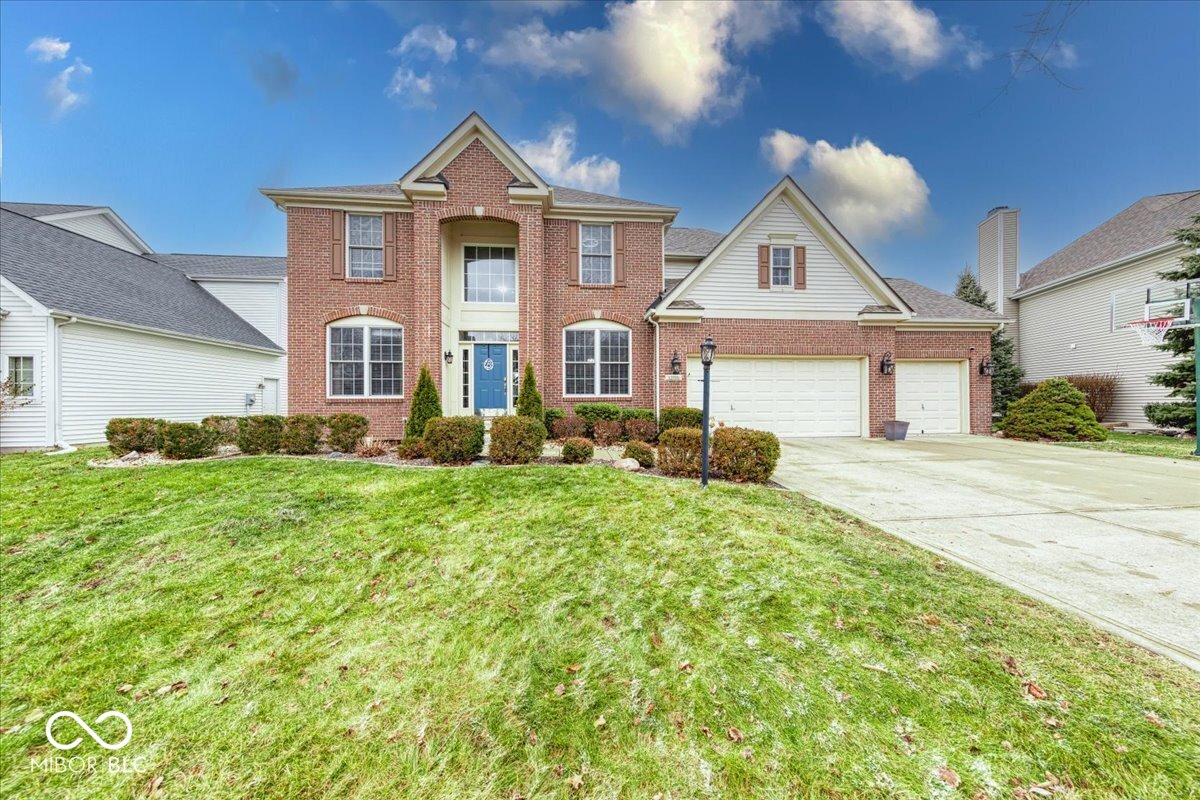 Welcome home to this beautiful residence located in the highly desirable Oak Hall community in Fishers, IN. This spacious home offers 4 bedrooms and 2.5 baths, thoughtfully designed for both everyday living and entertaining.    The main level features a bright living room with vaulted entry, a well-appointed eat-in kitchen, a formal dining room perfect for hosting gatherings, and a dedicated home office ideal for remote work or study. Main Level mudroom with utility sink adds everyday convenience. Enjoy outdoor living in the screened-in patio, with an additional patio space perfect for entertaining with private backyard.    Upstairs, the primary suite impresses with his-and-hers walk-in closets and a private en-suite garden tub and separate shower. A secondary bedroom also features a walk-in closet, offering excellent storage throughout.    The large finished basement provides exceptional additional living space with a playroom, rec room, and wet bar ideal for game nights and entertaining.    The three-car garage is a standout, complete with an exterior basketball court, while  Residents of Oak Hall enjoy access to a neighborhood pool and a welcoming community atmosphere. This exceptional home truly has it all and won't last long schedule your showing today!