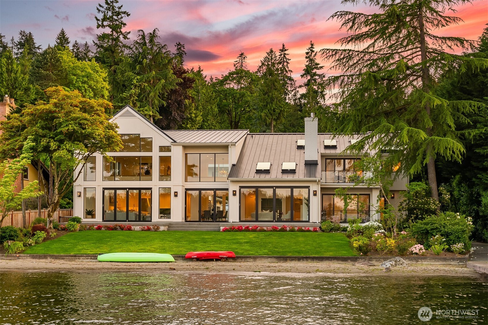 A rare opportunity at this custom, newly constructed waterfront jewel on a level lot. Enjoy year-round deep-water moorage for a yacht, smaller boats & water toys along the 65 feet lakefront. A manicured lawn leads to a sandy beach in a serene bay, perfect for wading into the calm water that reaches more than 10 feet deep at the end of the dock. The residence masterfully combines timeless design with contemporary elevated style. Expansive floor-to-ceiling windows frame panoramas, as light-filled living spaces showcase the designer finishes. The versatile floor plan adapts to every need. Relax and enjoy your morning coffee or evening wine on the generous deck. Located on North Island, offering easy access to both Seattle and Bellevue.