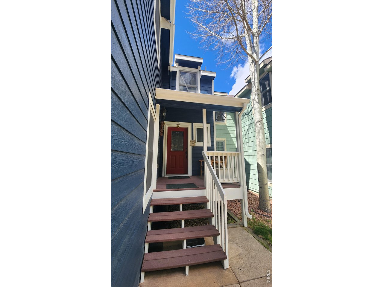Charming Victorian-style 3 bed, 3 bath condo on a desirable corner lot that lives like a single-family home. Enjoy generous indoor and outdoor entertaining spaces, including a private patio and spacious deck-perfect for taking in the peaceful surroundings just steps from the river. Inside, you'll find warm hardwood floors, granite countertops, and a comfortable, inviting layout. The lower level offers an unfinished room already plumbed for an additional bath, the choices for customization are endless. Make it a separate primary suite, office or workout room. Take advantage of river access without the added cost of flood insurance. Ideally located just minutes from recreation, including only 2 miles to the YMCA and Rocky Mountain National Park. Fishing, wildlife viewing, and outdoor adventures are right outside your door, while medical facilities, dining, and shopping are all nearby. Most furnishings are included, making this an easy move-in or turnkey opportunity. The HOA allows two pets and covers basic TV, allows you to fish on the river. Property holds a short-term rental permit, though it has never been used as a rental.