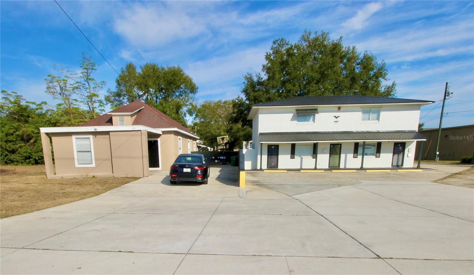 This commercial property with 6 units is an excellent income producer with various land use possibilities that is located on the heavily travelled Dundee Road, leading directly into the fast-growing town of Dundee! With a projected income of $8,850 per month, this property yields an astounding return on investment & will pay itself off before you know it. The property is a little over 1/3 of an acre, offering plenty of parking options & features 2 separate buildings: a duplex(1,384 heated Sq FT) & a quadruplex(2,131 heated SQ FT).  The duplex has a 2-bedroom 1-bath unit, currently leased for $1,500 per month & a 3-bedroom 1-bath unit that has been recently updated, including fresh paint, warm wood-laminate flooring, & new stainless steel appliances. This unit has an expected rental amount of $1,850 per month, & is currently vacant for easy showings during the sale.  The quadruplex is a well-maintained & strong 2-story concrete block building with a new metal roof. The 2 upstairs units have been recently renovated featuring upgraded wood-laminate flooring & nice kitchenettes with granite countertops. Both upstairs units are currently leased to the same tenant for $1,250 per month, each. The downstairs units are both currently leased together to a long-term tenant that will soon be vacating, & the new expected rent for these units is $1,500 per month, each. There is an Ansul System & a grease trap with one of downstairs units,  making it ideal for a restaurant-type business, although there are all sorts of businesses that would thrive in the space.  All together, both buildings feature fresh exterior paint which promotes strong curb appeal. Each building has its own septic system & water meter, with 6 separate electrical meters total: one per unit. Five units are equipped with newe mini-split A/C/heat systems, while the duplex’s 3/1 unit features central heat & air conditioning. The duplex, originally built in 1925, has an effective year of 1992 per county. The quadruplex was built in 1986 with an effective year of 2000 per county.  What’s unique about this property is that you get the best of both worlds, where on one side of the property sits the charming downtown area of Dundee, and on the other side boasts one of Polk County’s major thoroughfares, Hwy 27, that opens you up to the cities of Winter Haven, Lake Wales, & Haines City which are some of the fastest growing in all of Florida! Interested in earning $106,200 a year in passive gross income? Or better yet, why not jump on this opportunity to move your own growing business to this fabulous location w/ an option to conveniently live on site, while still receiving additional income from the other rental units?   Schedule a showing to see for yourself just how fast this property could become an easy money-maker for you!    This property could be subdivided & the duplex building sold separately on it's own at a price of $284,900.  The MLS# for this is: P4937607.  All measurements are approx & all info should be confirmed by buyer.