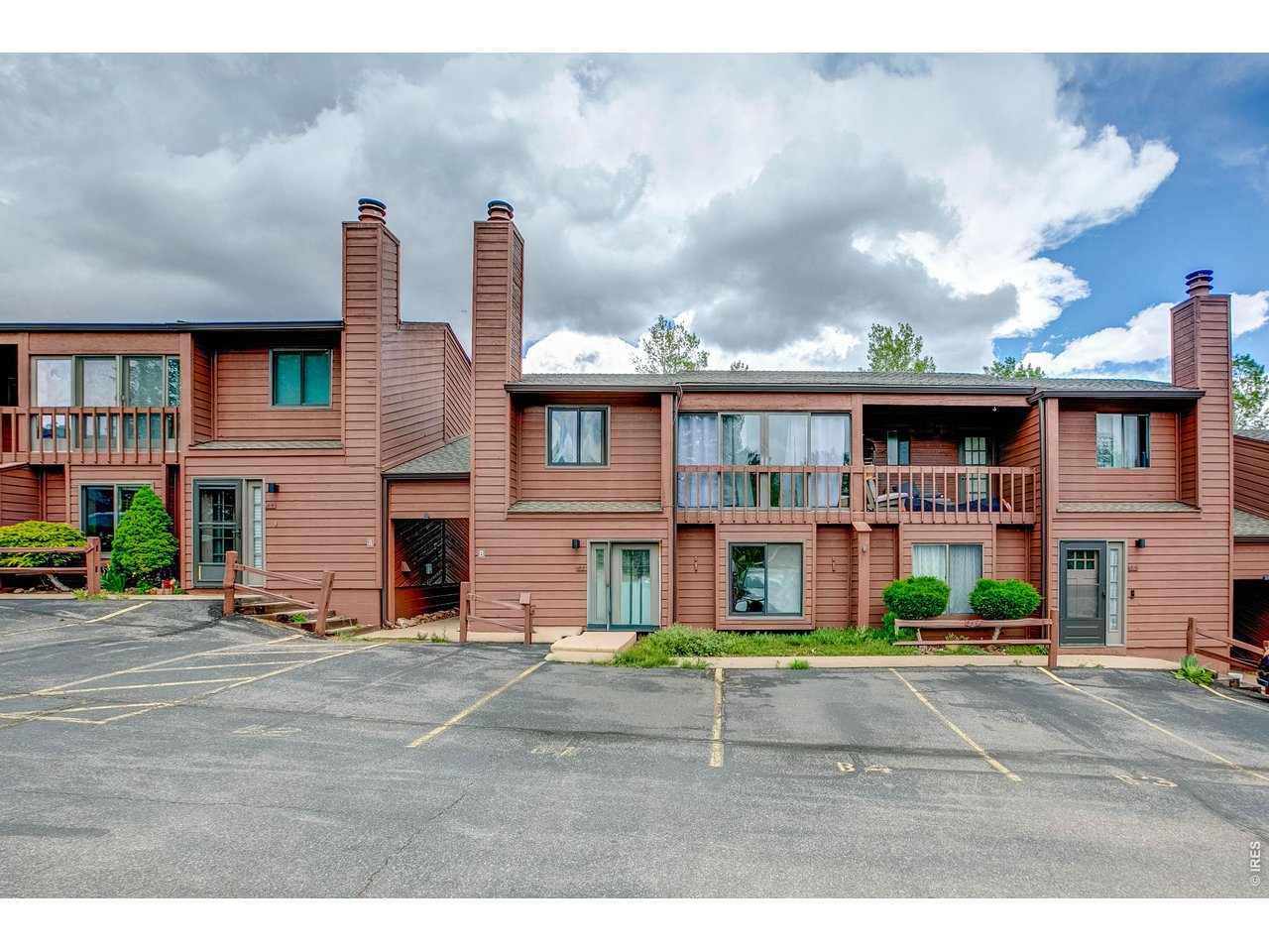Comfortable and affordable mountain living await at Eagle View in Estes Park. 2-bedroom, 1.5-bath condo conveniently located by the 18 hole golf course and priced to sell. Open floor plan on the main level with new carpet, a wood burning fireplace in the living room, spacious kitchen, large dining area, and a 1/2 bathroom with washer and dryer. The upper level has 2 good sized bedrooms with hardwood floors, a full bath, and an enclosed balcony to enjoy year round. Unit comes with an assigned parking space right at your front door. Flexible property can be used as a personal mountain retreat, a full time residence, or as an investment in the always strong real estate market of Estes Park. Low maintenance easy living with direct access to popular hike/bike trail, close to downtown Estes Park, and only a quick drive to Rocky Mountain National Park. Excellent value at $345K.