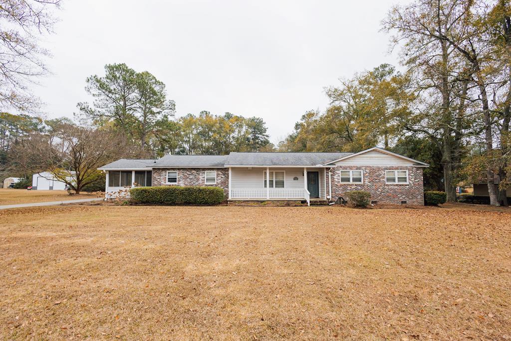 Great 3 bedroom, 2.5 bath home on 2.2 acres on Patterson St. in Thomasville.  Over 2300 square feet, open kitchen, Rec. room, family room, living room, screened porch, new back deck and out building.  Lots of potential, hardwood floors throughout.  Call for details.