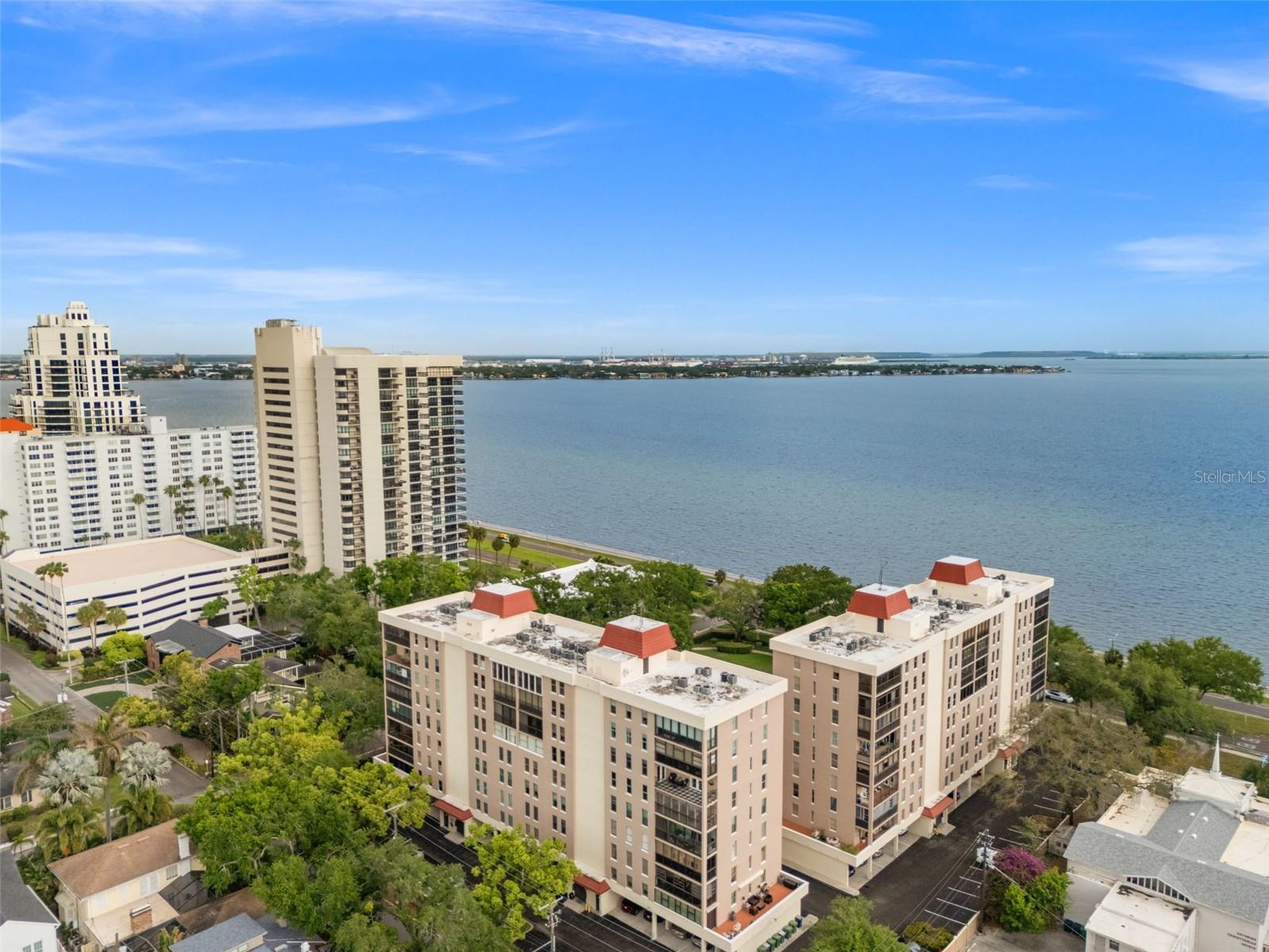 Beautiful Bayshore Condo at Howell Park...........Residential Living with Sweeping Views.............................Designed for those seeking an elegant lifestyle, this residence is ideally located in the vibrant heart of South Tampa.  Nestled within its own tranquil private park with grand oak trees and winding garden pathways.  Walking distance to favorite eateries, the Village of Hyde Park and the expansive promenade of Bayshore Boulevard right outside of your gate.  This boutique, mid-rise building offers a well-run and keenly maintained community with just enough social activities to enjoy.Step inside to an expansive floor plan that seamlessly connects the living, dining and kitchen areas.  Large windows throughout invite natural light and showcase picturesque views in every direction, making each moment at home feel bright and uplifting.  Enjoy an updated and well-appointed kitchen, new master bathroom, new bayside windows, custom doors, two new AC systems and two new water heaters, updated lighting and electric throughout, renovated private floor landing, and many more tasteful enhancements.  Residents enjoy the peace of mind that comes with living where owners are 55+ and there is a property manager and maintenance staff on site.  State of the art 24-hour security with guards on site and a new electronic system, and two new generators that serve all Howell Park