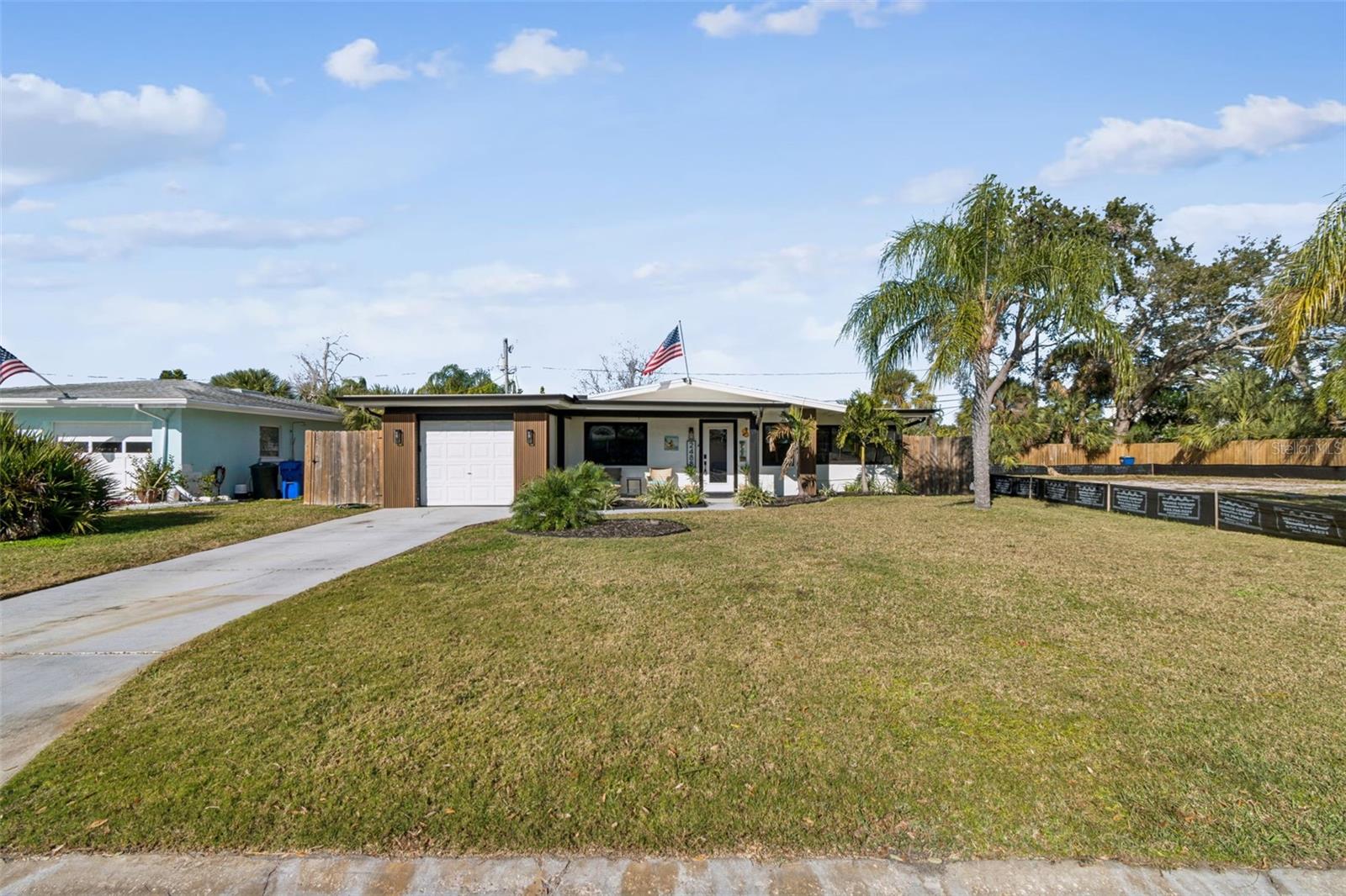 Welcome home to laid-back coastal living in the heart of Dunedin, Florida. Ideally located just minutes from the Dunedin Causeway, Honeymoon Island, Caladesi Beach, the Pinellas Trail, and the vibrant charm of downtown Dunedin, this beautifully updated home offers an exceptional blend of style, comfort, and location.Eye-catching curb appeal welcomes you with contemporary accents, updated lighting, and lush tropical landscaping. The inviting front porch is the perfect place to enjoy your morning coffee while soaking up the Florida sunshine. Step inside to a bright, open-concept living space filled with natural light and thoughtfully selected finishes throughout. The home was completely remodeled following the 2024 hurricanes, creating a truly move-in-ready, turnkey opportunity.The stunning kitchen serves as the heart of the home and features solid wood shaker cabinetry, stone countertops, elegant brass hardware, and brand-new stainless steel appliances. The seamless flow into the living and dining areas make this space ideal for both everyday living and entertaining. The dining area is highlighted by rustic wood ceilings and exposed beams, adding warmth, character, and a subtle coastal charm.A desirable split-bedroom floor plan provides privacy and flexibility, with the primary suite set apart from the secondary bedrooms. All bedrooms are generously sized and versatile, ideal for guests or a home office. Both full bathrooms have been beautifully updated with cohesive finishes, including a sleek glass-enclosed shower in one and a tub/shower combination in the other.The fully finished laundry room doubles as a stylish butler’s pantry, complete with additional cabinetry, stone countertops, and a utility sink—bringing both form and function to daily life. Impact-rated windows installed in 2020 offer peace of mind and energy efficiency. The home is also currently under a transferable NFIP Group Policy for flood insurance, providing added value and convenience for the next owner.Outside, the fully fenced backyard offers low-maintenance living with turf, an inviting patio, and plenty of room to create a custom outdoor oasis or add a pool. Just a short bike ride from downtown Dunedin’s popular restaurants, breweries, boutique shops, golf courses, and year-round community events, this home delivers the ultimate Florida coastal lifestyle.A rare opportunity to own a fully remodeled home in one of Pinellas County’s most sought-after coastal communities