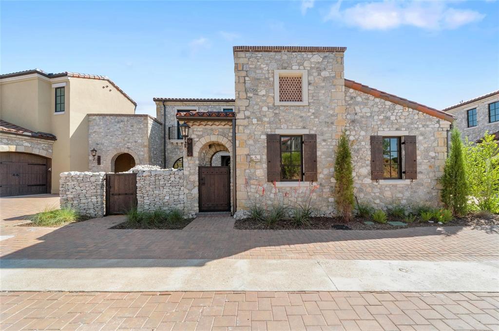 Amazing canal front Town Home Villa lock and leave style with Spanish Architecture integrated with a modern interior located in Westlake Entrada, a walkable community modeled after a Catalonian village in Spain. Commercial grade appliances, gourmet kitchen, spacious primary suite with spa-like bath and a study room on first level with Spacious front private courtyard views. Amazing canal views from the family room and master bedroom with a balcony to enjoy the views. The Upstairs offers two bedrooms with ensuite baths and a storage room with additional balcony for front courtyard view. Downstairs offers ensuite guest bedroom along with game and media and wet bar combo. Once you step out enjoy the covered patio and fabulous views of the canals and water fountain. Backyard with turf with zero maintenance. Zoned for both Carroll ISD and the International Baccalaureate Westlake Academy.