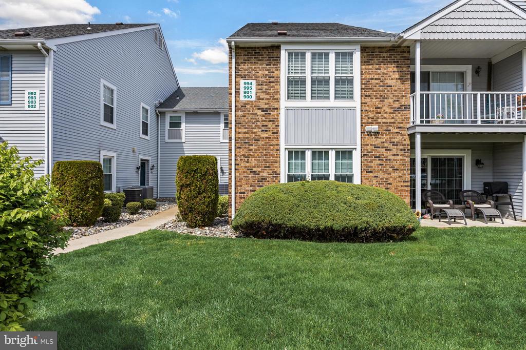 This is the one you’ve been waiting for! Rare Granada model, meticulously maintained by the original owner and thoughtfully updated throughout. This sun-filled 2-bedroom, 2-bath home offers a desirable layout and a prime location with pleasant views.The spacious primary bedroom features two closets and an updated en-suite bath complete with a Swanstone stall shower and built-in seat. The second bedroom includes a walk-in closet and convenient access to the full hall bath—ideal for guests or a home office.The updated eat-in kitchen is both stylish and functional, boasting 42-inch cabinetry, Corian countertops, an undermount sink, and an abundance of smart storage solutions, including pull-out shelving and corner cabinet optimization. A stainless steel appliance package, highlighted by a French door refrigerator, completes the space. The laundry area is conveniently located just off the kitchen.Major system updates include HVAC and hot water heater, both replaced approximately 3 years ago, offering peace of mind for the next owner.Located in a vibrant 55+ community, residents enjoy a wide array of amenities including a clubhouse, pool, tennis courts, dog park, and an active social calendar. Ideally situated directly across from a shopping center with a major grocery store, plus easy access to numerous shops, dining options, and everyday conveniences.Don’t miss this rare opportunity to own a move-in ready home in a highly sought-after community!