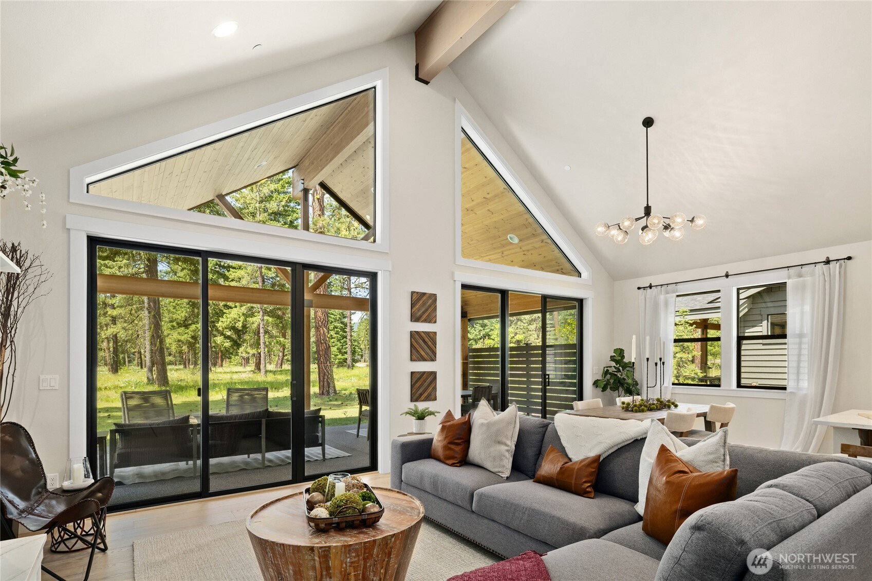 Bright open, and inviting living room with large beam.
