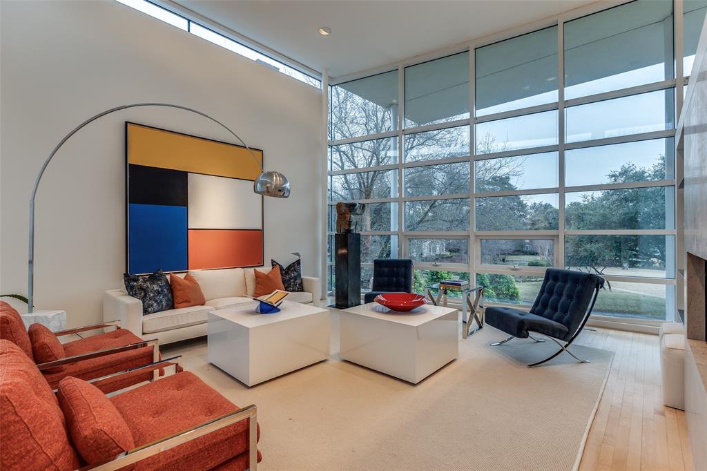 Experience the epitome of contemporary luxury in this breathtaking limestone-clad home, designed by renowned architect Lionel Morrison and built in 2001. This architectural masterpiece offers an exceptional blend of style, comfort, and functionality, located steps from Flippen Park. The first floor features a spacious entry with beautiful marble floors, elevator and stairwell access to the second floor, as well as generously sized secondary bedrooms, each with an en-suite bathroom. The second floor offers open-concept living spaces and dining with tall floor to ceiling windows and sweeping views of Flippen Park. The recently renovated sleek Bulthaup kitchen is equipped with Miele appliances, a dedicated wine refrigerator, and convenient access to a large outdoor kitchen and living area. An oversized primary suite with a spa-inspired en-suite bathroom and a study complete the second floor. The low maintenance backyard is lined in evergreen magnolias for privacy, has a tranquil water feature and gas fireplace — perfect for entertaining. A separate, additional 282 sq ft air conditioned flex space adjacent to the backyard is currently storage, but plumbed and ready to be converted into a guest suite, gym or studio. Additional highlights are pier and beam construction, a large 3-car garage with ample storage, and 3 new AC units for modern efficiency and comfort. This timeless home offers a unique opportunity to live in an architecturally significant home while enjoying the serenity and beauty of Flippen Park. Short walk to Highland Park Village, Bradfield Elementary, and Whole Foods. Schedule your private showing today!