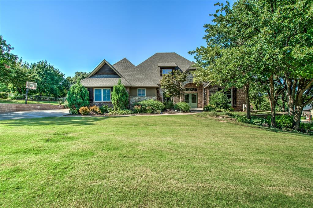 This Gorgeous Corner lot home combines luxury living with a serene setting. The brick and stone give it curb appeal that will draw you in, and the well landscaped yard sets up a beautiful place for gathering! You can almost see yourself sitting on the front porch watching the lightning bugs or maybe everyone is gathered on the large back patio watching the logs on the fireplace pop with little embers. You’ll be greeted at the front door with wood flooring that leads you to a giant open living space. The large stone fireplace point you to tray ceilings met with beautiful crown molding. The kitchen would be a great gathering place with quartz countertops and Knotty Alder custom cabinets. There’s an island for prep work, and two pantries... PLUS a gas cooktop. All 4 bedrooms are downstairs!  You'll find the master suite located on one side of the home including necessary features like patio access, a walk-in closet, a whirlpool tub, tiled walk-in shower, and dual vanities. The study has large window and access to the powder bathroom. The other side of the home includes bedrooms #2 & #3 with a Jack and Jill bathroom. While bedroom #4 has its own full bathroom with shower. The laundry room is located on this side of the home as well. Upstairs there is a bonus room with a built-in desk and just down a small hallway is a HUGE BONUS room or game room with storage cabinets and a full bath. The bonus room also features a balcony overlooking the backyard where you can see the beautiful flower beds but it’s tucked in for privacy behind the trees. This home has brand new carpet in all the bedrooms and fresh paint throughout the house so that it is move-in ready for you! The community has a pool and playground and even a pond. It has easy access to I 35 so you’re close to everything. You don’t want to miss seeing this one, schedule your appointment today!