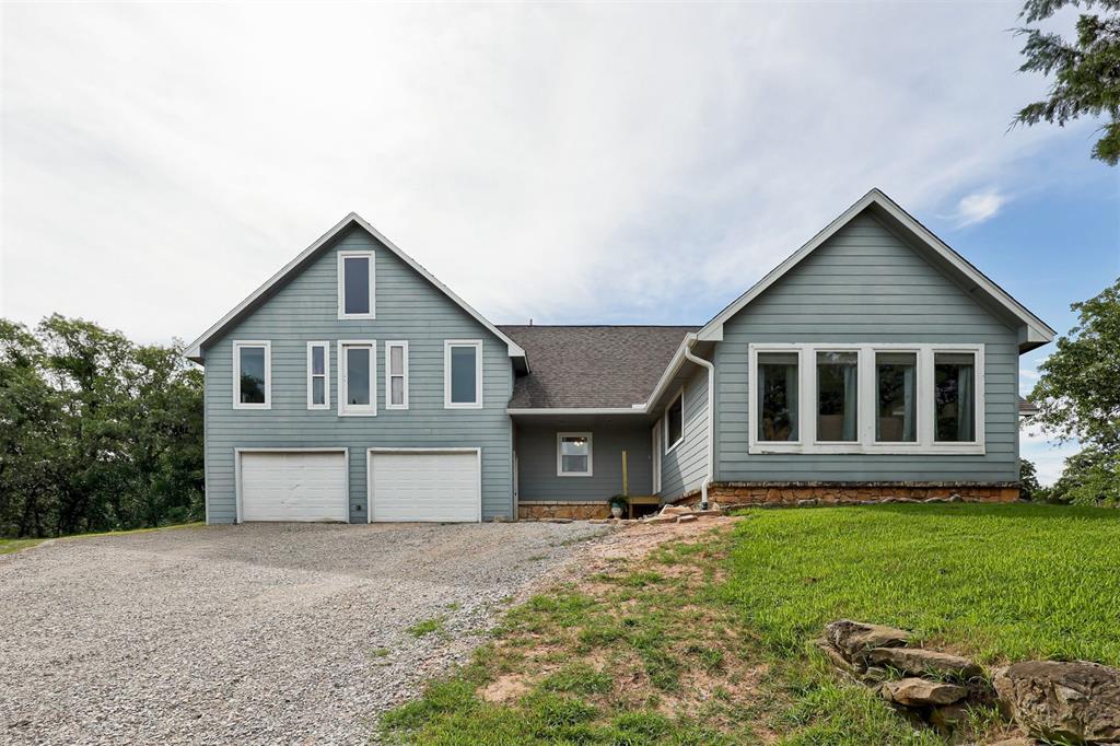 Such a unique property on 11 acres that attaches to the Core of Engineers Land on Lake Thunderbird!  This home will wow you as you walk in with the huge family room that makes you feel like your in a cabin in the woods with wood ceiling and a wood burning fireplace.  Dining room is between kitchen and living room and offers a wonderful open feeling with separation for large get togethers.  Kitchen offers huge island with a ton of counter space and storage. 2 bedrooms on main level and 2 baths.  An office and a family room with a ton of windows on the back of the house.    Upstairs you will find the 3rd bedroom big enough to have its own living area.  Also upstairs is another bathroom and a loft great for storage, a play area or to be finished out for another room or bunk space.  2 car garage has spray foam insulation and spacious.  Outbuildings are on property and with some work could be additional living space or workshops.  Covered back patio and so much privacy and nature on this property