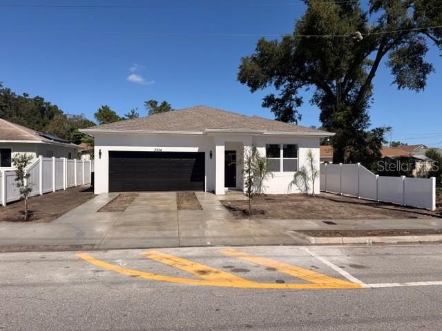 LOCATION LOCATION LOCATION,LITERALLY IN THE HEART OF TAMPA JUST FEW MINUTES AWAY TO YBOR CITY,DOWNTOWN QUITE FRANKLY EVERYTHING IS WHITHIN MINUTES AWAY FROM BUSH GARDENS TO TAMPA INTERNATIONAL AIRPORT.WE HAVE AN MODERN 4 BEDROOM, 2 FULL BATHROOMS AND A 2 CAR GARAGE,THE SECOND YOU WALK IN YOUL WILL SEE ALL THE QUALITY WORK YOU WOULD STEP IN THE FOYER THEN TO YOUR RIGHT YOU HAVE A BEDROOM WITH DOUBLE CLOSET FOR YOUR CONVENIENCE THEN  A LARGE KITCHEN WITH COMPLETE FULL HEIGHT BACKSPLASH LEVEL 2 GRANITE ALL STAINLESS STEEL APPLIANCES AND CROWN MOLDING AS WELL BEAUTIFUL DARK GRAY SHAKER CABINETS WITH BLACK HANDLES WITH A BREAKFAST BAR FOR YOUR CONVENIENCE AND RIGHT ABOVE IT THERE ARE 3 LUXURY PENDANTS. THER IS A HIGH CEILING THROUGH OUT THE HOUSE AND IN THE LIVINGROOM THERE IS A GORGEOUS TRAY CEILING WITH A NICE LARGE FAN THERE IS ALSO A SINK IN THE LAUNDRYROOM WITH ITS UNIQUE GLASS DOOR.GUSET BATHROOM IS IN THE MIDDLE OF 2 ROOMS WITH BEAUTIFUL VANITY LIGHT AND A GORGEOUS GRANITE TOP LAST BUT NOT LEAST YOUR PRIMARY BEDROOM WITH A DOUBLE WINDOW,, A WALK IN CLOSET AND MY PERSONAL FVORITE IS THE TRAY CEILING IN THE PRIMARY BATHROOM THERE ARE HIS AND HERS VANITIES WITH SAME MODERN LIGHTS WITH GORGEOUS GRANITE TOP A WALK IN SHOWER WITH ITS NICE ENCLOSURE AND WATER CLOSET HAS ITS OWN DOOR. THE HOUSE IS COMPLETLY FENCE IN FOR YOUR PRIVACY.THIS HOUSE IS PRICED EVEN LESS THAN  A 3 BEDROOM HOUSE IN THE SAME NEIGHBORHOOD HURRY BEFOE IT IS LONG GONE.