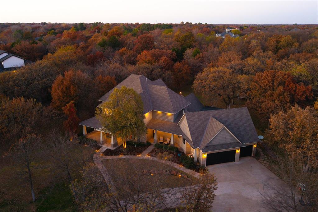 Introducing a rare offering for those who value privacy, elegance and connection to nature. Perfectly situated on approximately 2.5 wooded acres inside the prestigious gated community of Red Rock Lake in Southeast Edmond, this property promises a lifestyle defined by comfort, sophistication and serene outdoor living.Crafted in 2012 with quality and intention, and lightly remodeled in 2019-2020 inclusive of roof replacement, this Craftsman-style residence blends timeless architectural character with modern appointments. A generous and flexible layout delivers 5 bedrooms or 4 bedrooms plus executive office, a dedicated theater, an expansive bonus and game room and 4 full bathrooms to accommodate family living and refined entertaining.Every space invites relaxation and gathering. The open living environment flows naturally toward picturesque outdoor amenities. A spacious patio takes center stage with a beautiful brick firepit, enveloped by mature trees and peaceful natural views. Here, the value of land and privacy comes to life. Whether hosting memorable evenings by the fire or planning a future pool, sport court or captivating garden landscape, the options are endless.Notable enhancements include a circular driveway for gracious arrivals, dedicated outdoor living room, high ceilings, heated primary ensuite flooring, built in grill/outdoor kitchen, quality finishes throughout and the benefits of being within the highly regarded Edmond School District.Residents of Red Rock Lake appreciate the balance of seclusion and community, where nature, wildlife and neighborly connection remain central values. Homes with this level of acreage, design and lifestyle appeal are truly uncommon.A $2,500 preferred lender credit is available to qualified buyers.Private showings are encouraged for those seeking a luxurious retreat with room to grow and the comfort of a family-oriented community.