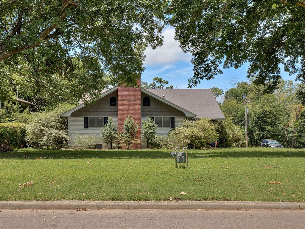 Long before Lakewood Park became one of Norman's most sought after addresses, there was a couple with a dream and a plot of land. This home was the very first built in the neighborhood, a lake retreat imagined for a young, growing town. Nearly seventy years later, it is being offered to the public for the first time in its history.There is something rare about a house that has never changed hands outside a family. The bones here tell that story: generous room sizes, real craftsmanship, and a layout built for gathering rather than passing through. Fresh paint and hardwood floors run throughout the downstairs, warming every room they touch. Two of the three bedrooms come with their own private bathrooms, a rare comfort for a house of this era. Two stories anchor the home on nearly half an acre, with two fireplaces to gather around through the seasons. Downstairs, a full sized basement holds a temperature controlled shop, ready for projects and hobbies any time of year (not included in the home's listed square footage).  Step out to the balcony and look out over the neighborhood pool, included with ownership of this home, just steps from your own backyard.Only five minutes from the University of Oklahoma campus and the Sam Noble Museum, this address puts football Saturdays, museum afternoons, and campus life within easy reach, all while offering the quiet of an established, tree lined neighborhood.The first family wrote the first chapter here. Now it is time for the next one. Come see what this Lakewood Park original has to offer, and start writing your own story at 2616 Walnut Rd.