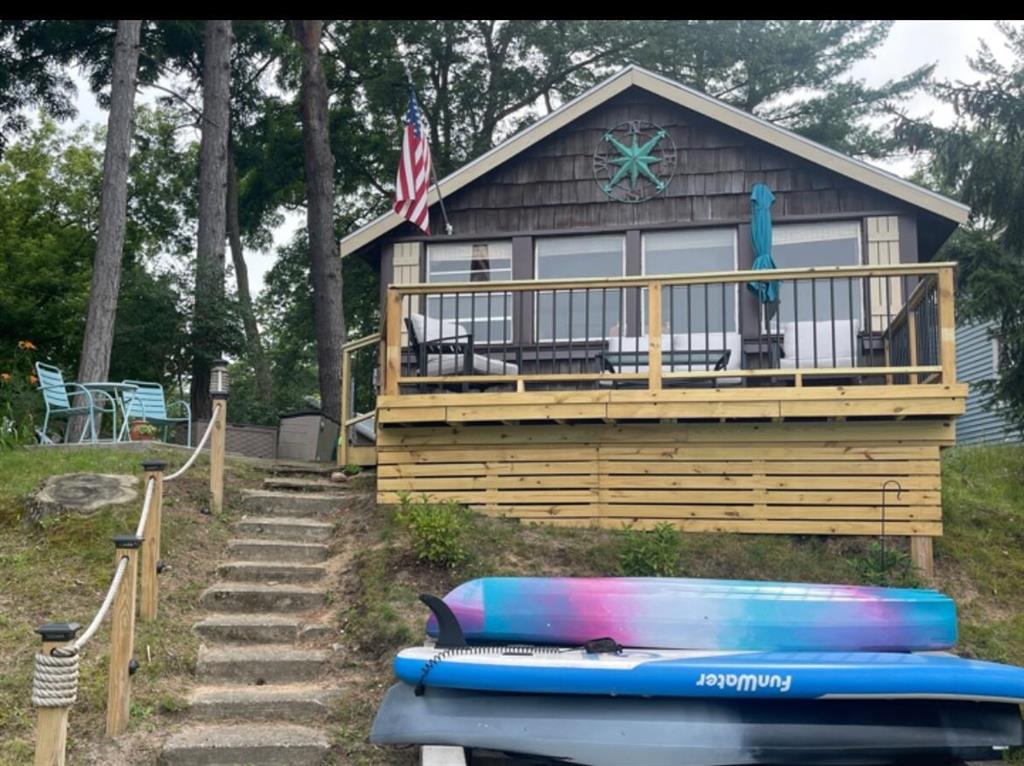 Lake George Lakefront - Cute as can be, 2 bedroom, 3/4 bath, cottage on this all sports lake. Has a seawall & deck overlooking the lake where you can sit and enjoy your day and watch all the water fun activities. Across the street is a garage, parking, on 5 lots. Enough space to build something new. Walk to this fun town offering, pizza, ice cream, gift shop, tavern, church, 2 boat launches for 2 all sports lakes with great fishing.