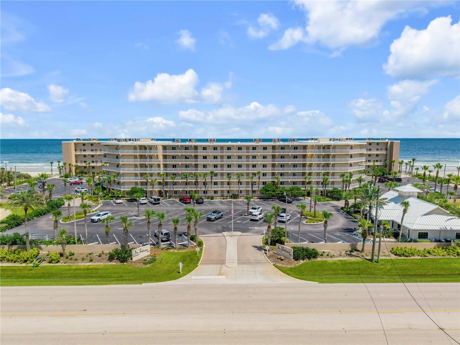 DIRECT OCEANFRONT. TWO STORY TOWNHOME. OCEAN FACING. FULLY FURNISHED. LOW HOA FEES. Welcome to The Pelican, where spectacular Atlantic views, an exceptional location and a unique two story floor plan come together for the ultimate New Smyrna Beach lifestyle.Light, bright and beautifully appointed, this 2 bedroom, 2.5 bath residence is filled with natural light and positioned to take full advantage of its oceanfront setting. The main living level opens to sweeping views of the Atlantic and a private oceanfront balcony, the perfect place for morning coffee, salty breezes and spectacular New Smyrna Beach sunrises.Inside, CUSTOM CABINETRY THROUGHOUT provides exceptional storage while giving the home a polished, cohesive feel. The open living and dining areas make entertaining effortless, while the two story design provides separation and privacy with both ensuite bedrooms located upstairs.Offered FULLY FURNISHED and ready to enjoy, this property also offers an attractive opportunity for buyers looking to combine personal use with rental income. HEALTHY RENTAL ROLLS are established and can be provided upon request. Weekly rentals add flexibility and income potential.The Pelican completed extensive renovations in 2022 and has passed required milestone inspections. Community amenities include TWO OCEANFRONT POOLS, paver sun decks, grilling stations, shuffleboard and a private gated beach walkover, all with LOW HOA FEES for a direct oceanfront community.Walk or bike to restaurants, Publix, fitness and local favorites, with Flagler Avenue just minutes away. Whether you're searching for a full time beach home, weekend escape or income producing oceanfront property, this one delivers the combination that's increasingly hard to find: DIRECT OCEANFRONT, TWO STORIES, FURNISHED, ESTABLISHED RENTALS and LOW HOA FEES. Just bring your swimsuit and toothbrush.Be sure to check out our Video Walkthrough.