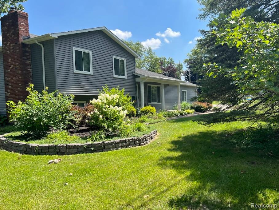 Completely remodeled 3-bedroom, 2-bath home with Lake Fenton canal frontage! Bank-appraised at 2,014 sq ft (+/–) of living space, this beautifully updated home features a stunning kitchen with granite countertops, vaulted ceilings, and designer finishes. The open, inviting floor plan includes a family room with a cozy fireplace, perfect for gatherings. Enjoy the convenience of a 2-car garage and modern updates throughout. Move right in and start living the Lake Fenton lifestyle with canal access just steps from your backyard!