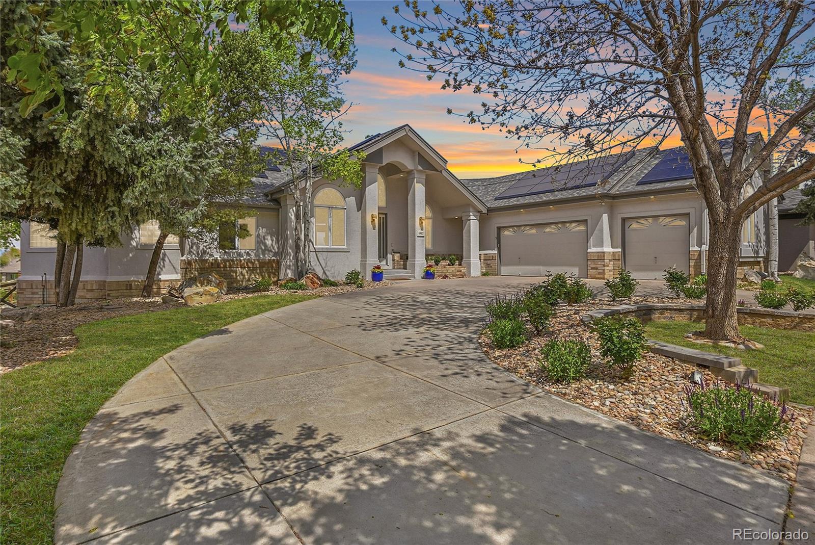 Experience elevated Colorado living in this exceptional luxury ranch-style home perfectly positioned on a private .33-acre cul-de-sac lot backing directly to the 9th fairway of Legacy Ridge Golf Course with breathtaking mountain and golf course views. Designed for both elegant entertaining and everyday comfort, this meticulously updated residence offers 4 bedrooms, 4 bathrooms, a finished walk-out basement, and an extraordinary blend of luxury, privacy, and modern upgrades.The newly remodeled chef’s kitchen is a true showpiece featuring stunning porcelain countertops and custom cabinetry, upgraded designer lighting, and chef-inspired appliances. The open-concept layout flows seamlessly into the spacious living room highlighted by a dramatic stacked stone fireplace with custom mantel, and expansive windows framing incredible mountain/fairway views.The luxurious primary retreat offers patio access, huge walk-in closet, and spa-inspired bath complete with soaking tub, oversized shower, dual sinks, and dedicated dressing/vanity area. A custom office and formal dining room provide flexibility for work and entertaining. Downstairs, the walk-out basement features beautifully appointed secondary bedrooms. A stunning custom bathroom renovation was just completed!  The inviting gathering space with full wet bar is waiting for you.Outdoor living is equally impressive with a new maintenance-free deck, professionally landscaped grounds, mature trees, sprinkler system, and a covered lower patio featuring a pine ceiling and custom drainage system. Enjoy year-round comfort and peace of mind with radiant heated flooring throughout, a new boiler, two new AC units, whole-house water filtration system, Moen emergency water shutoff system, exterior steel shutters, solar panels, new roof, and fresh exterior paint. The home has been pre-inspected! Completing the home is an oversized 3 car garage in an unmatched setting. This is Colorado luxury living at its finest.