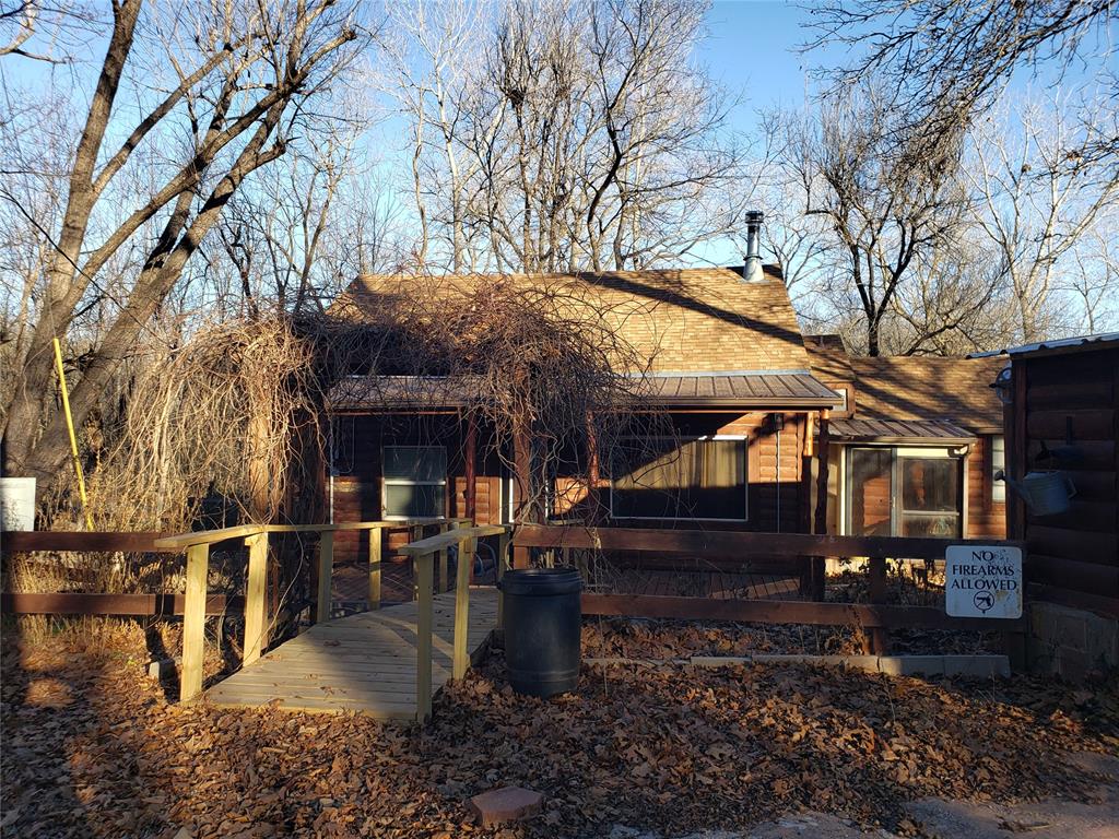 WELCOME TO THE LOG CABIN IN THE WOODS!  This charming, rustic 3 bedroom, 1.5 bath cabin sits on 5 acres near Lake Thunderbird.  Nestled in the woods, you'll enjoy the tranquil, peaceful lifestyle with an abundance of wildlife.  Inside, you'll stay cozy on those winter nights with the wood burning stove.  The refrigerator and washer/dryer will stay.  Plenty of space outdoors to entertain or simply enjoy the nature that surrounds the home.  Property has a large storage building and 2 small metal storages, storm shelter, carport large enough for 3 vehicles or a boat, and several updates to include new roof, plumbing, sewer line, some electrical, hot water heater, and attic insulation to name a few.  This could be your dream home or your weekend lake getaway retreat!