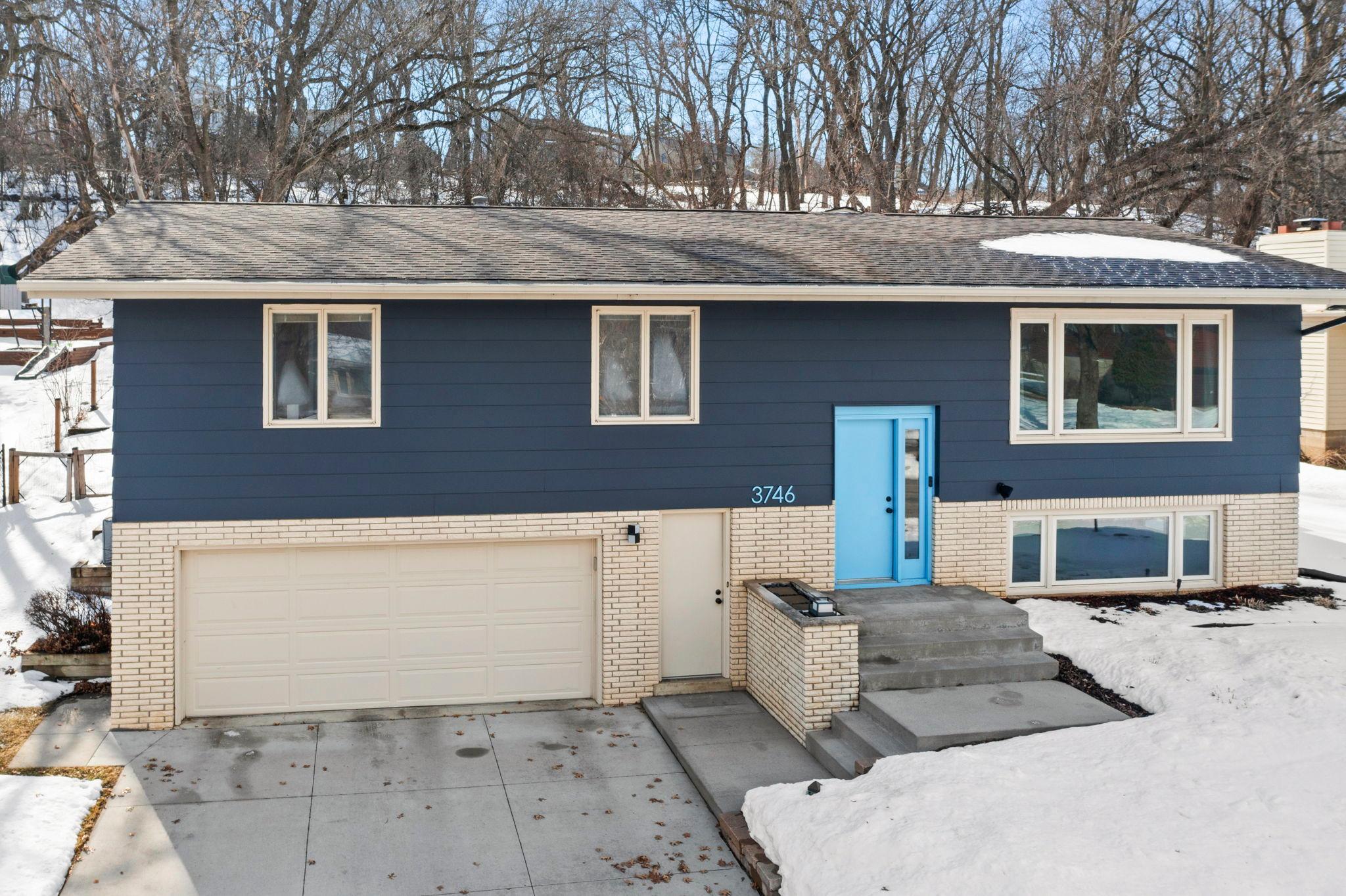 Welcome to this spacious 3-bedroom, 3-bathroom home nestled on a quiet Rochester cul-de-sac, backing to a peaceful wooded setting. Located near Cascade Lake with trails, a swimming beach, and fishing, you’ll enjoy convenient access to shopping, coffee shops, and downtown while maintaining a serene atmosphere.Inside, a bright sitting room welcomes you with updated LVP flooring (2021) and large windows that fill the space with natural light. The open dining area flows seamlessly into the kitchen, creating an ideal layout for everyday living and entertaining. The kitchen features white cabinetry, stainless steel appliances (2021), ample counter space, and a breakfast bar with seating.The adjacent living room opens to a covered deck overlooking the fully fenced backyard, complete with an irrigation system, firepit, and spacious lawn, perfect for relaxing or hosting gatherings. The main level also includes a beautifully remodeled full bathroom (2025) and three bedrooms, including a primary suite with dual closets and a private ¾ bath (2025). The lower level expands your living space with a family room, versatile bonus room, half-bath, heated garage access, and abundant storage. This home blends thoughtful updates, flexible spaces, and a private natural backdrop.