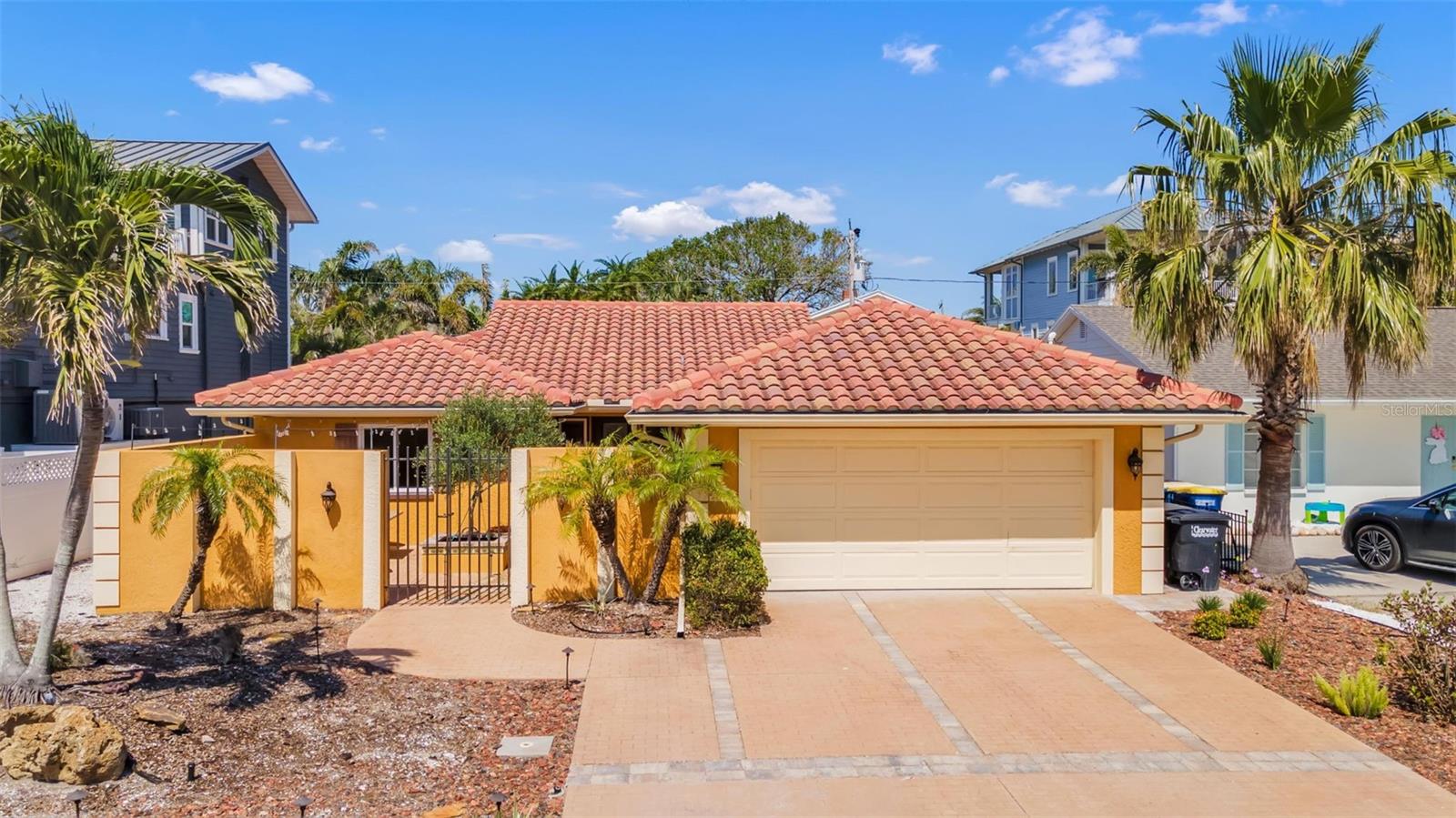 Grandfathered flood insurance (transferrable) that is only $2600 and Pre-storm FEMA Appraisal in-hand for $1.2m! Nestled within the exclusive Carlouel neighborhood, sits a very well appointed 3 Bedroom / 2 Bathroom home, that is just a short walk to the tranquil and soft-sandy shores of the North Beach via private gated access! This beautiful home underwent extensive renovations from 2021-2022. Some of the key features, that set it apart from most other homes in the neighborhood: block construction, open-concept floorpan w/vaulted ceilings, secluded courtyard in the front, quaint backyard that can accommodate a spa (pre-wired) or a small plunge pool (see renderings), clay tile roof, additional pet/beach shower in Laundry Rm, epoxied two car garage with large driveway, fully operational HVAC (located on roof/attic), electric and plumbing (including natural gas for WH and stove), along with saltless water treatment service.  Home suffered damage in Helene, was professionally remediated, and is now awaiting your finishing touches! Walk to Carlouel Yacht Club!
