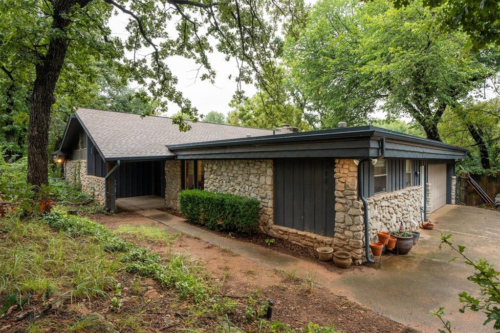 Nestled in the quiet, established Rolling Creek Addition, this beautiful home offers a serene, wooded setting with gorgeous mature trees. Inside, you’ll find four spacious bedrooms, with one easily adaptable as a home office. The living room boasts floor-to-ceiling windows and a beautiful cathedral ceiling, filling the space with natural light and offering stunning views. Step out onto the back deck to enjoy your private retreat surrounded by nature’s beauty. This home is the perfect place to call home!