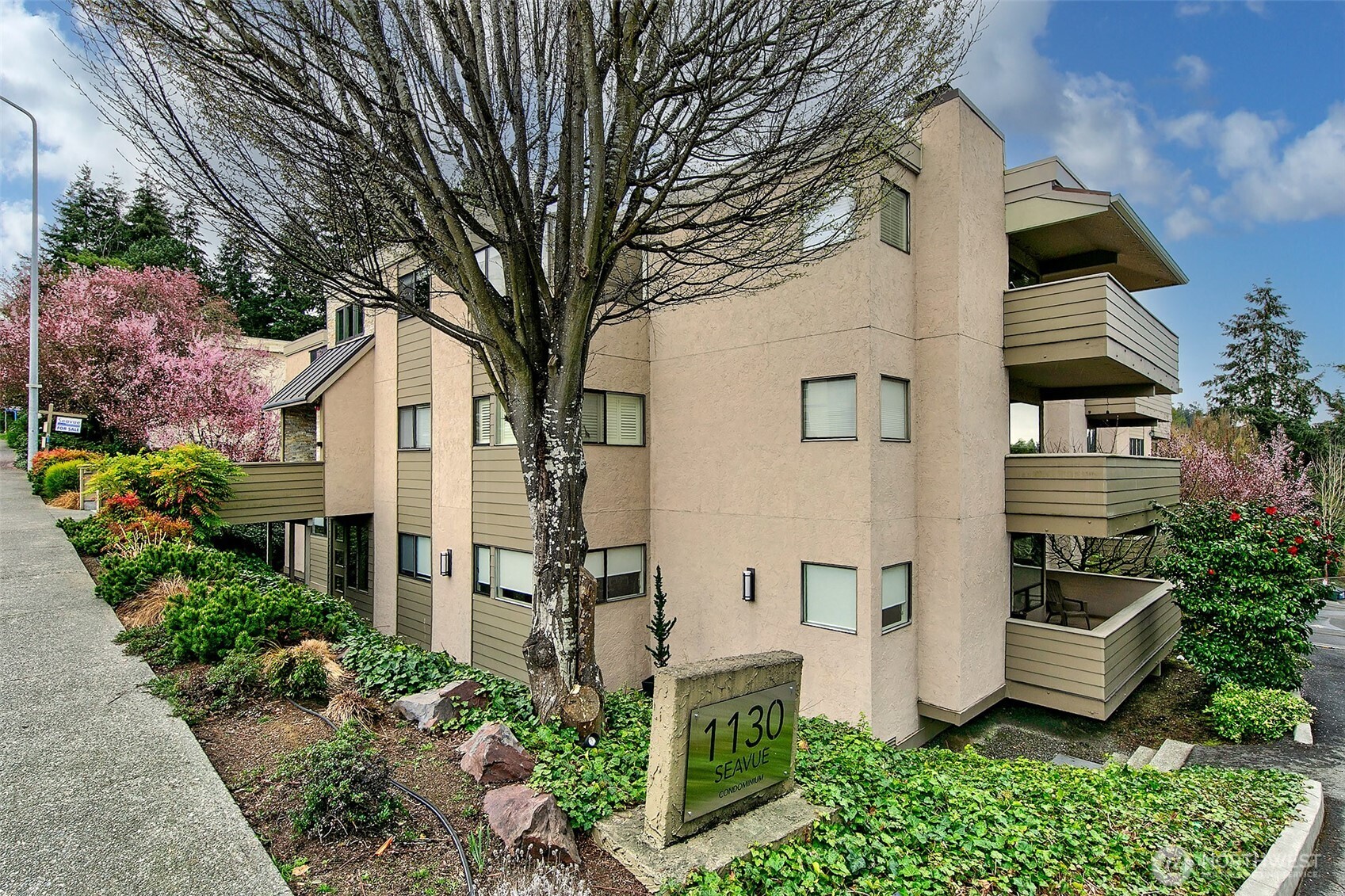 Best value in Downtown Edmonds! Immaculate Condo in The Seavue lives like a house! Big living room with electric fireplace and a formal dining room with sliders to large, private wrap around deck, perfect for entertaining. Spacious kitchen with eating space, lots of cabinets & adjacent laundry room with newer water heater + storage. Lovely Primary Suite with en-suite bath. Radiant heat in ceiling. 1 car parking in common garage & additional private storage cabinet. Complex has an elevator & HOA Dues include earthquake insurance, cable TV & internet. Convenient location- walk to Downtown Edmonds & within a matter of minutes be shopping & enjoying pubs & eateries! Also steps from bus line & centrally located for both North & South commute.