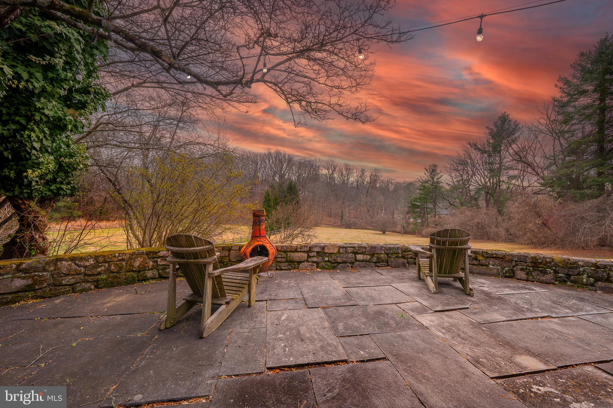 Set along one of Radnor Township’s most picturesque and quietly prestigious streets, this 2.3 acres Boxwood Road property offers an exceptional setting and a rare opportunity. The lot itself is the true asset—generous in scale, beautifully sited, and surrounded by a collection of tasteful, high-value homes representing multiple architectural eras.The existing 1954 stone Colonial provides a placeholder footprint, offering four bedrooms and three-and-a-half baths, but the value lies squarely in the land and its orientation. The rear of the property faces south, capturing long, uninterrupted wooded views that feel both bucolic and private—an ideal backdrop for a thoughtful renovation, significant expansion, or a complete architectural re-imagining.Public water and sewer, along with natural gas, are already in place, simplifying the path forward. Boxwood Road is known for its discretion, beauty, and enduring appeal, making this a compelling offering for those seeking a premier Bryn Mawr location and the freedom to create something truly special.