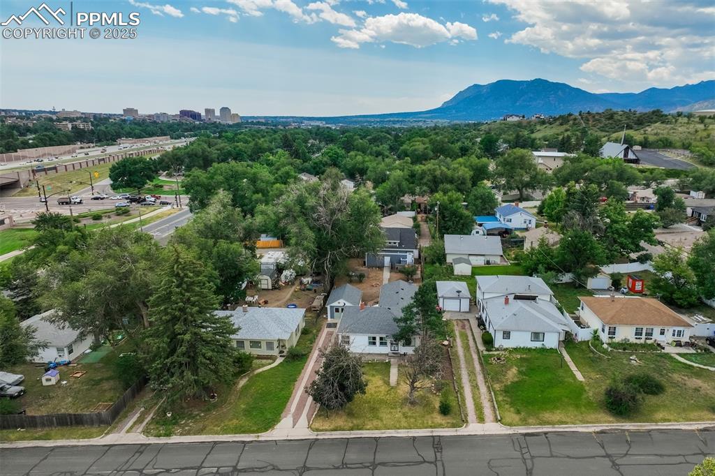Unique property with two homes! The front home is a 3 bed, 2 bath and detached shop/1 car garage. There is also ADU above the 2-car detached garage that was built in 2017! The owner lived in the ADU and rented out the house. The front house is a 1,500+ SF rancher, hard wood floors in the living room, hallway & 2 bedrooms, LVP in the dining room & primary bedroom, and both bathrooms have tile. Both bathrooms were updated, and the roof for the front house and sewer line were replaced in 2022. There is a gorgeous 5-piece bath with custom stonework, double sinks, separate shower, and a soaking tub. The primary bedroom has a unique stained-glass window, large walk-in closet with custom shelving & an ensuite bathroom with a shower. The kitchen has a large pantry, stainless steel dishwasher & stove (both replaced approx..6 months ago), & an included refrigerator. There is a large dining room & laundry room. Buyers will love the large, fenced lot that offers space to garden, entertain & play. The one car detached garage was converted into a shop/storage space. The oversized, heated 2 car garage with an over the garage ADU is located at the rear of the property and accessible from the alley. This darling 704 SF has a private entrance, 1 bedroom, 1 bath, living room, dining room, kitchen and laundry room. The kitchen has black stove, stainless steel dishwasher & refrigerator, counter microwave and large kitchen pantry. The bathroom has transom windows, a separate shower, clawfoot tub & custom tile. With a great westside location, this property has so many possibilities!