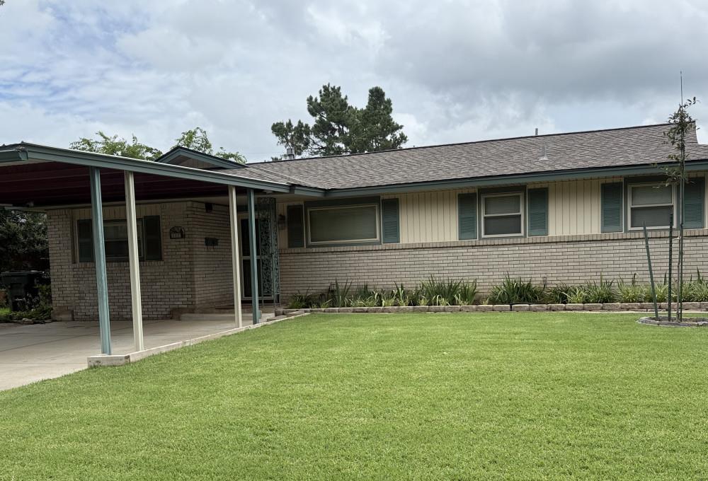 This *1210 sq. ft. home has been optimized for space and convenience. Extended Master Bedroom with open space for reading, dressing, or exercising. The guest room is conveniently located across the hall from a full bath. Bathroom comes with a built-in storage closet. The living room gives way to a converted garage-to-family room. The raised formal dining area is separated from the kitchen by the indoor utility closet, which houses a stacked washer/dryer, ready to use. A natural gas stove, dishwasher, and refrigerator all remain, no worry about finding appliances. This home is ready. Bonus features include: The 9’ x 16’ bright, temperature-controlled enclosed patio area is great for a craft room, bird room, plants, or office space for remote work. Spectacular view of the backyard, a hidden gem. The exterior is surrounded by generous walk paths and multiple flowerbeds. The double driveway features a sturdy carport with lighting for security. The backyard offers a storage building with electricity, a greenhouse with gas heat and electrical outlets, and an additional open decorative outbuilding for storage, a potting bench, also with electrical outlets, a ceiling fan, and a light. Beside the open patio is an above-ground storm shelter, also wired with electricity, perfect for those persons with mobility issues when facing unpredictable weather. Then there's the jewel: enjoy your days with the soothing sound of four custom-built water garden ponds! These water garden ponds will bring you hours of relaxation and are ready to enjoy. This home could be perfect for everyone, from first-time buyers to retirees or downsizers. Priced to sell, ready to enjoy.
