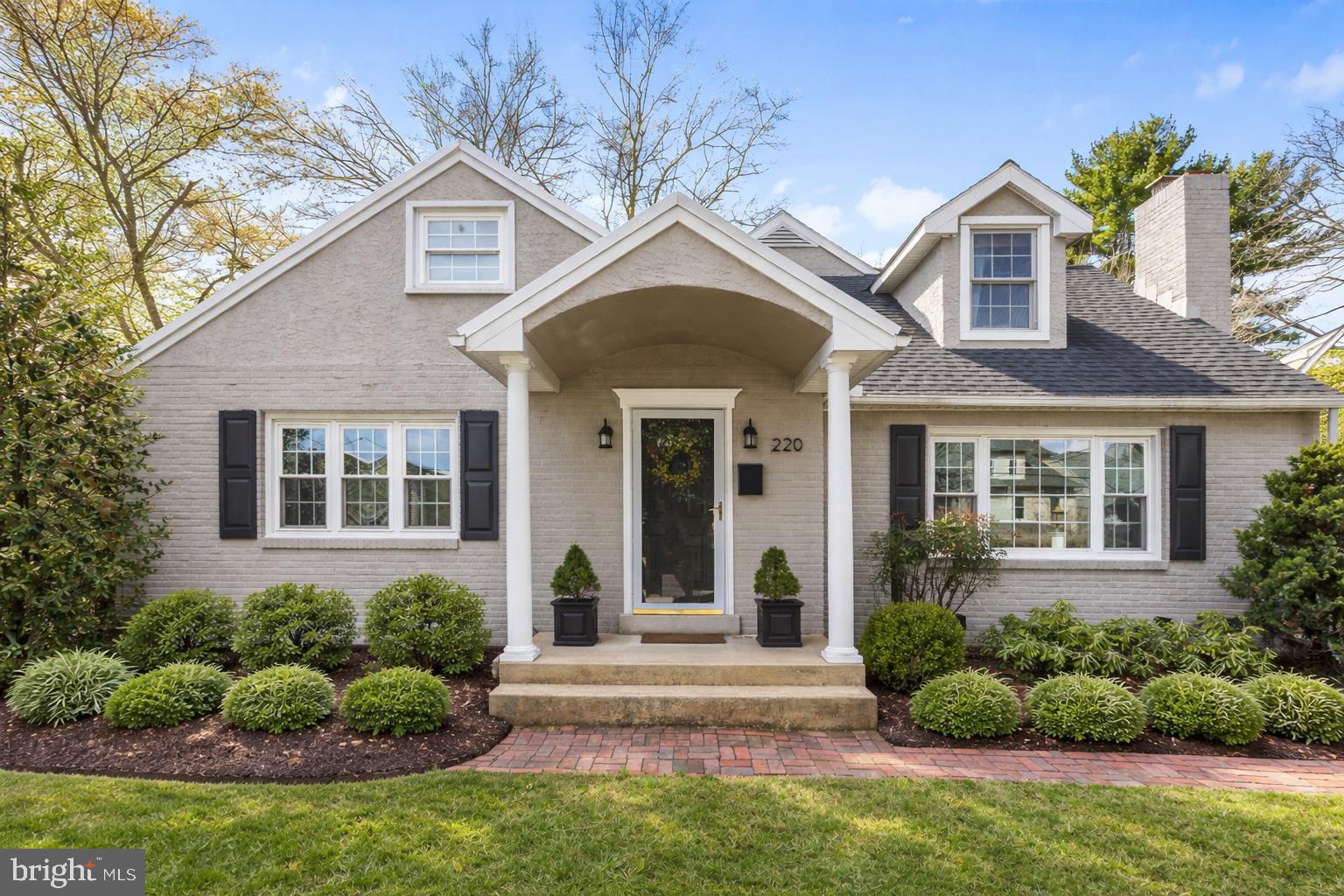 Welcome to 220 S Valley Forge Road! A blooming magnolia tree sets the scene, welcoming you to this storybook Cape Cod where charm and thoughtful updates come together in the most effortless way. With timeless character and a layout designed for modern living, this is a home that feels as special as it looks.Step inside to a warm and inviting foyer. To your right, a spacious formal living room is anchored by an oversized bay window, framing picturesque views of the magnolia tree and filling the space with natural light. Through an arched doorway, the home opens beautifully into the dining area, creating an effortless flow for everyday living and entertaining alike. The kitchen, renovated in 2024, is both beautiful and functional. Quartz countertops, pendant lighting, an induction cooktop, double ovens, and stainless steel appliances come together in a space designed for how we actually live today. Just beyond, the home completely opens up into a breathtaking two-story vaulted great room. With oversized windows and French doors overlooking the backyard, this space is flooded with light. Custom built-ins flank a grand stone fireplace, creating a cozy focal point. The first-floor primary suite is a true retreat. Generous in size and filled with natural light, it features a beautifully appointed ensuite bath with a soaking tub, glass-enclosed shower, double vanity, and a private water closet, plus a spacious walk-in closet. A powder room and a well-designed laundry room with a utility sink and direct access to the backyard patio complete the first floor.Upstairs, you’ll find a flexible and thoughtfully designed second level. A spacious bedroom suite with its own ensuite bath offers privacy and comfort, while two additional bedrooms; each filled with natural light, share a well-appointed hall bath that also features direct access from one of the bedrooms. The unfinished basement provides a blank canvas with endless potential; whether for storage, a home gym, or future finished living space. Throughout the home, you’ll find hardwood floors, fresh paint, and pride of ownership at every turn. Outside, the fully fenced backyard feels like a private escape, complete with a brick patio, mature landscaping, and even a gated driveway. A detached one-car garage adds both charm and convenience. And then there’s the location- just moments from everything Devon has to offer. Around the corner from favorites like Anthropologie and Terrain, the Devon Horse Show Grounds (just in time for spring), Whole Foods, and the Devon train station for easy access to Philadelphia. You’re also minutes from the King of Prussia Mall, major roadways including 202, the Blue Route, Turnpike, and Schuylkill Expressway, and surrounded by outdoor gems like Valley Forge National Park, Jenkins Arboretum, and the Radnor Trail. All within the award-winning Tredyffrin-Easttown School District.