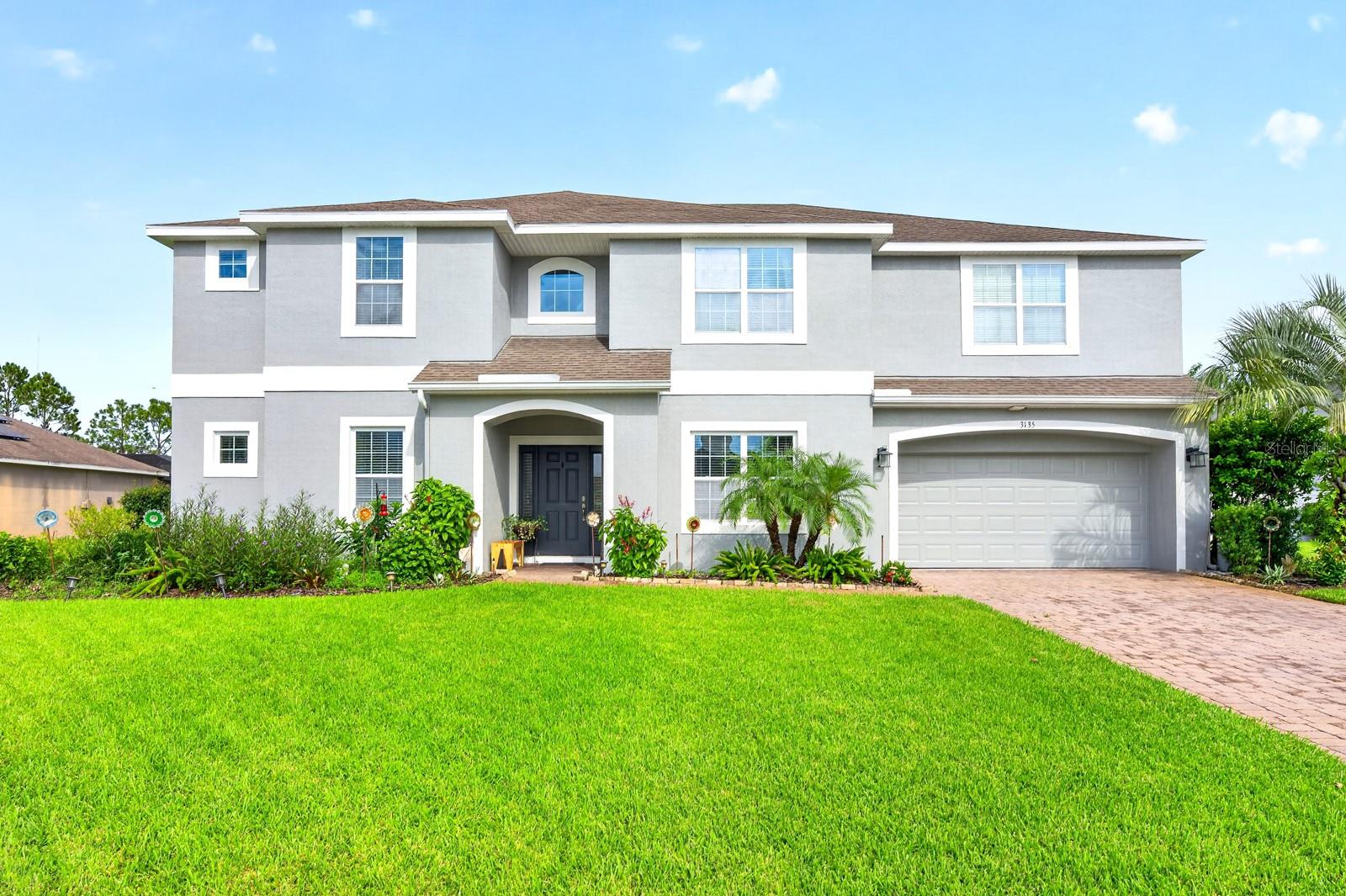 Over 4,000 SQ FT of curated living space, PRIVATE POOL, TWO PRIMARY SUITES and a sprawling .53 ACRE LOT set the stage for this impressive Mandalay home! Located in East Orlando’s 32820, this expansive two-story home offers a SCREENED POOL, 3-CAR GARAGE, THEATER ROOM, HUGE LOFT and a versatile layout with PRIMARY SUITES on BOTH FLOORS. Mature landscaping and fruit trees enhance the curb appeal, while the oversized homesite provides plenty of outdoor space and room between neighbors. Inside, SOARING CEILINGS welcome you into a dramatic TWO-STORY FOYER with formal living and dining spaces on either side. The spacious family room also features a TWO-STORY CEILING and CATWALK VIEWS from above, opening seamlessly to the UPGRADED KITCHEN and casual dining area. Sliding glass doors lead to the COVERED LANAI and PRIVATE POOL for effortless INDOOR/OUTDOOR living and entertaining. The MAIN-FLOOR PRIMARY SUITE is privately positioned on its own wing with a large WALK-IN CLOSET and well-appointed en-suite bath. Upstairs, a SECOND PRIMARY SUITE occupies its own wing with another generous WALK-IN CLOSET and impressive private bath. The loft and dedicated theater room (just bring the popcorn!) add even more flexible living space for movie nights, a game room, home office or additional lounge area. With more than 4,000 square feet, this home offers an abundance of space to spread out, entertain and make your own. Mandalay residents also enjoy a COMMUNITY POOL and PLAYGROUND along with the generous lots that give the neighborhood an open feel. Ideally located near LAKE PICKETT with easy access to SR 408, SR 417 and SR 528, plus neighboring UCF, Valencia College, Research Park, Waterford Lakes Town Center, Avalon Park and Oviedo are all just minutes away. Shopping, dining, parks, beaches and Central Florida attractions are also within easy reach. Room to grow inside and out and a floor plan that is anything but ordinary – this Mandalay pool home delivers! Call today to schedule a tour!