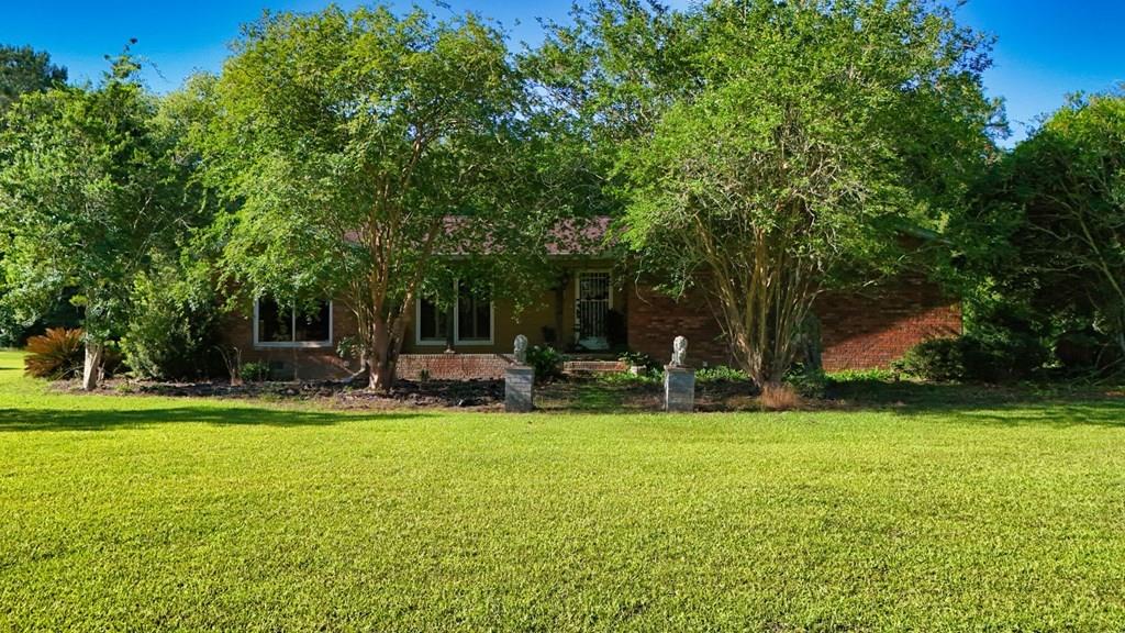 Welcome to 4187 Tanglewood Road, a unique, one-of-a-kind home! Each room is beautifully hand-painted and packed with character! This spacious, 2,037 sq ft, brick home sits on 2.96 acres, and offers 3 bedrooms, 2 bathrooms. Outside, you can enjoy relaxing in the gazebo while overlooking the lined koi pond, and built-in sprinkler system. The roof and the HVAC system are both 2 years old! Call today for a showing!
