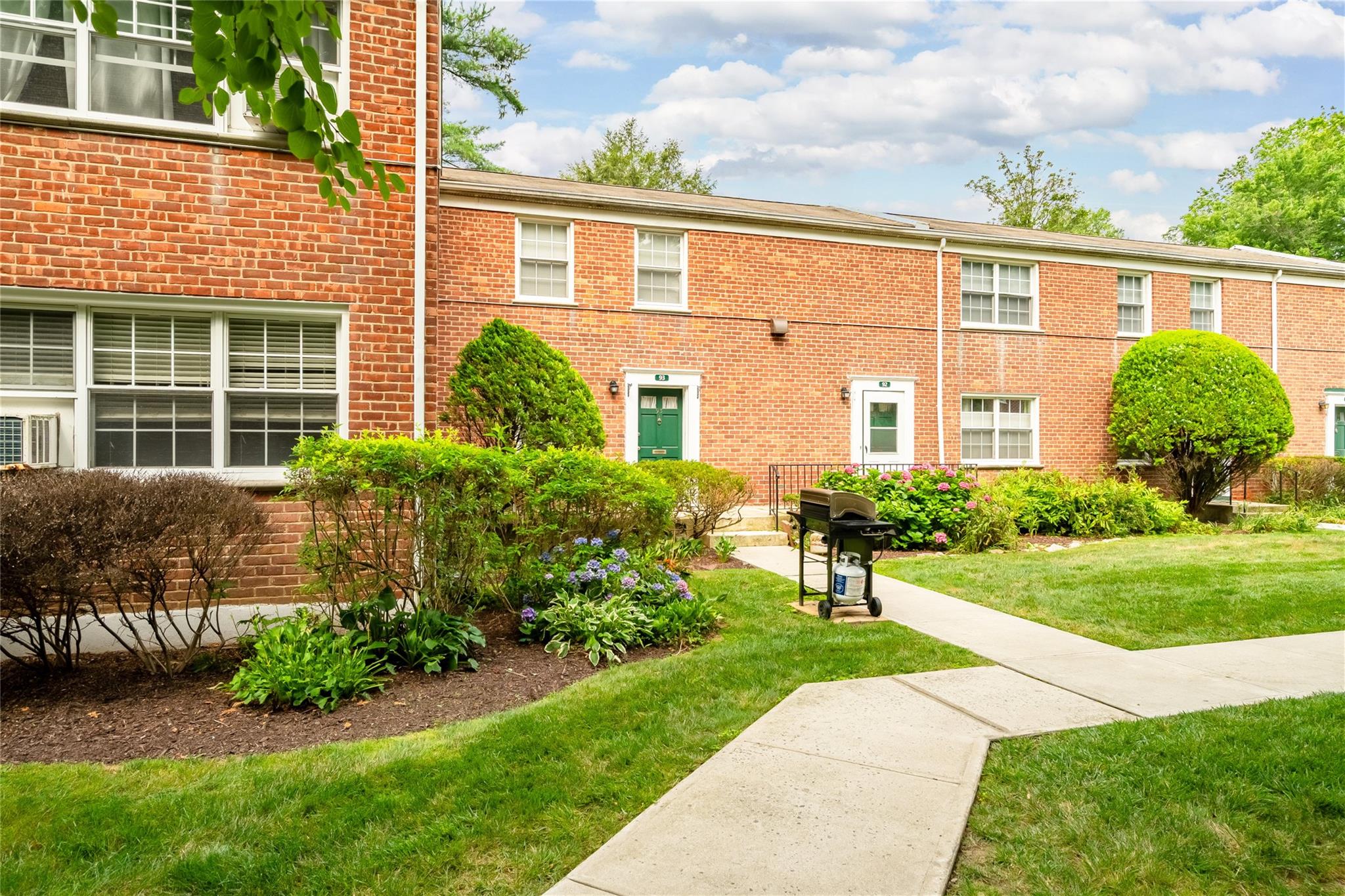 Step inside this inviting first-floor garden-style co-op in the highly desirable Rex Ridge complex in Hartsdale. Unit 93 blends the comforts of home ownership with the convenience and ease of apartment living. Featuring a spacious one-bedroom layout filled with abundant natural light, this move-in-ready home offers stainless steel appliances, ample closet space, and the added luxury of an in-unit washer-dryer. The living room is spacious enough for a home office & overnight guests, the kitchen has generous counterspace and the sizeable bedroom has deep double closets. 
Enjoy your own outdoor patio - perfect for al fresco dining and grilling. The beautifully maintained complex offers lush garden-like grounds, a seasonal pool, playground, bike storage, and convenient parking options (assigned parking available, with optional garage or assigned parking on a waitlist). Subletting is permitted after three years of occupancy, and one cat is welcome.
Perfectly situated near the Hartsdale and White Plains train stations, with easy access to shopping, dining, highways, and the extensive park adjacent to the complex, Rex Ridge provides all the advantages of a single-family home without the upkeep. Maintenance fees conveniently cover taxes, heat, hot water, sewer, trash removal, landscaping, snow removal, pool care and an on-site super.
Don't miss your chance to experience effortless living in this sought-after community, schedule a private showing today!