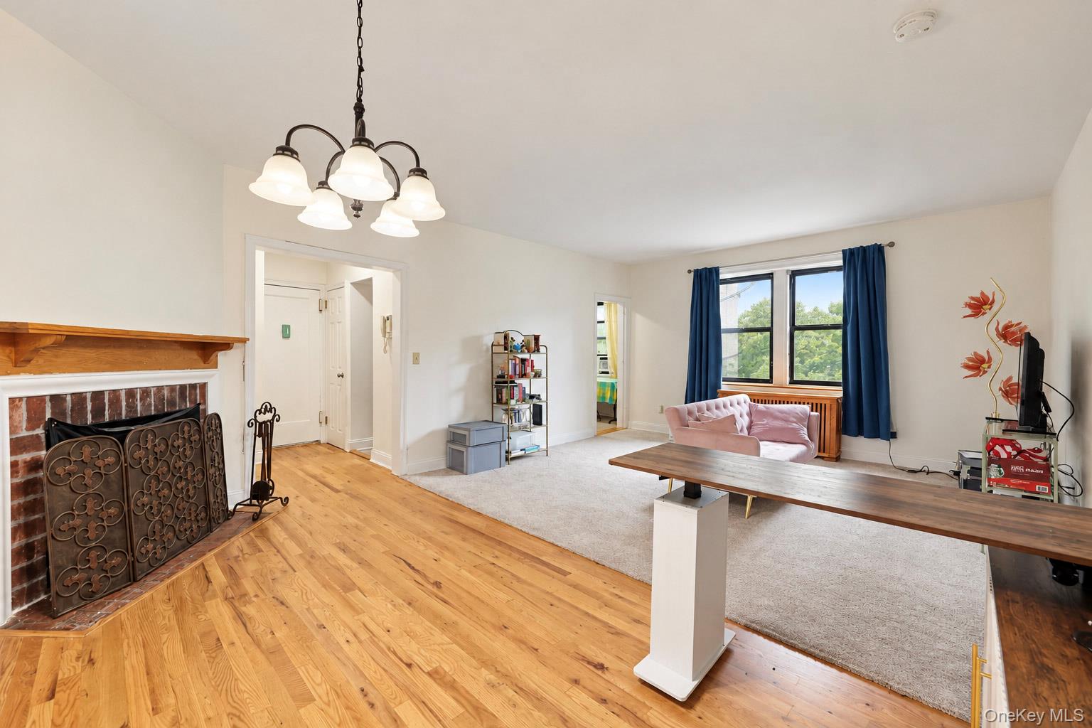 Welcome home to Unit 4K at the highly desirable Country Club Apartments. This exceptional 1-bedroom, 1-bathroom corner cooperative expertly fuses classic architectural character with comfortable, modern updates. Step through the welcoming entry foyer into a sun-filled, oversized living room that serves as the centerpiece of the home with plenty of room for a dining area or office space. Anchored by soaring ceilings and gleaming hardwood floors. The thoughtfully designed layout flows effortlessly into a windowed, eat-in kitchen complete with new LED lighting and plenty of prep space. Tucked away for optimal privacy, the large bedroom offers an abundance of natural light and boasts a massive, custom walk-in closet, and direct access into the well-appointed bathroom. Situated in a premier, pet-friendly elevator building (dogs and cat’s welcome!), residents enjoy access to an array of fantastic amenities. Relax on the tranquil outdoor garden terrace, or make use of the well-equipped fitness center, on-site storage, bike room, card-operated laundry facilities, and the convenience of a live-in superintendent. Leave your car behind! You are a short distance away from a vibrant selection of downtown shops, restaurants, a seasonal farmers market, and the Hartsdale Metro-North Station—offering a stress-free, 35-minute express commute into Grand Central Terminal. Don’t miss your opportunity to own a piece of pre-war perfection in Westchester!