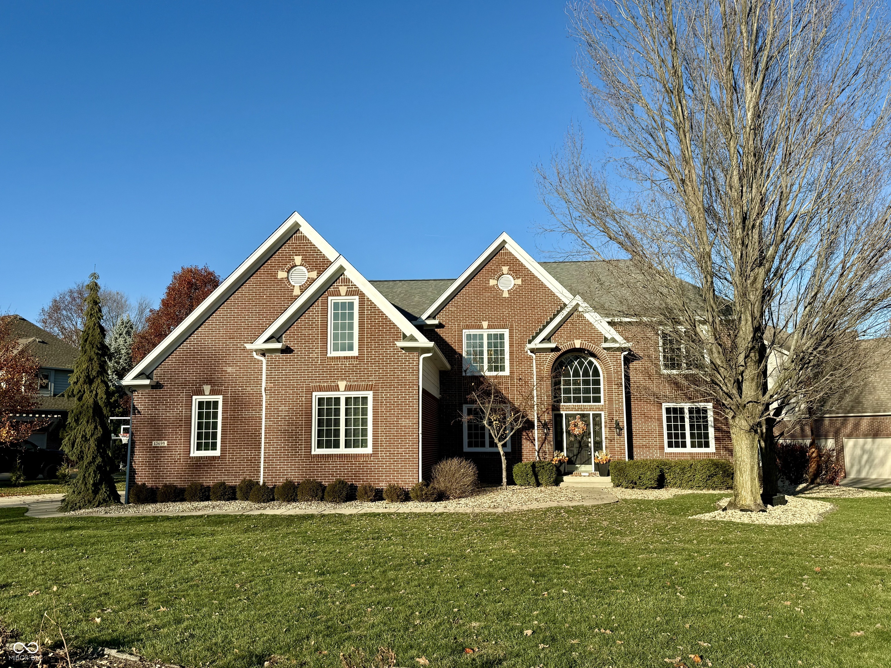 Beautifully maintained home in sought after Cambridge with BOAT DOCK w/ canopy and lift located on deep cove just down the street! This home has an open floor plan with plenty of room for large gatherings. The updated kitchen has stainless steel appliances and granite countertops with white cabinetry and hardwood flooring. You'll love the sunroom located just off the two-story great room. There is a private office in front of the home across from the formal dining room. The beautiful staircase leads up to the second floor with four bedrooms and a LARGE bonus room that could easily be converted into a fifth bedroom. The generously sized primary suite has two separate closets and a light and bright bathroom. The spare bedrooms are also nicely sized. The lower level has daylight windows with a rec area, fireplace, bar, spare room that could be converted into a bedroom, a full bath, and ample storage. The yard is over a third of an acre and nicely landscaped. The boat dock is a short stroll down the street. Unlike many other neighborhood docks, this dock is located on deep water and situated so that it is easy to pull a boat in and out. Three car garage. Geist Elementary is located just outside the neighborhood, and the other schools are conveniently located up Olio Road. Hamilton Town Center is also close. The Cambridge neighborhood is popular due to its custom homes and fantastic social activities. Don't miss out on this WONDERFUL home!!