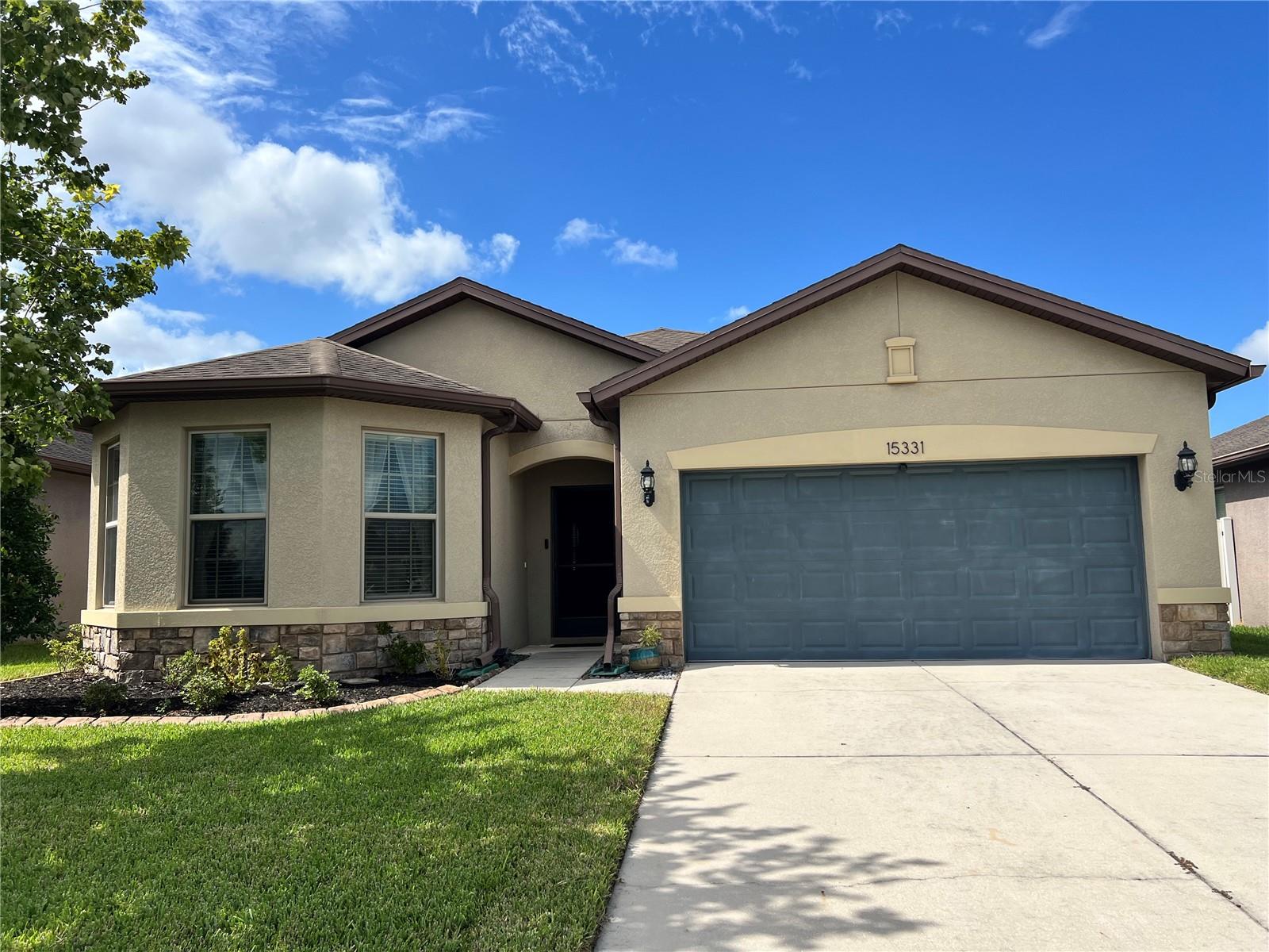 Welcome Home to the highly sought after Trillium Community of Brooksville! This move in ready home shows the owner's pride. You will love this beautiful, 3-bedroom, 2 full bath, 2 car garage home, built in 2017 with 1,700 square feet heated space and 2265 total space. As you enter through the screened and Glass front door you will walk into a spacious Foyer leading you too the Tiled open floor plan with spacious great room with tray ceiling & kitchen/ nook room. The kitchen features tall kitchen cabinets with crown Molding, kitchen island with drawer and storage space, pantry, large dining/nook area, recessed lighting, all stainless-steel appliances include side by side refrigerator, microwave, dishwasher, new Stove with air fryer feature, all new countertops and sinks in kitchen and bathrooms. The open layout makes this space as sociable as it is functional. This split-floor plan with 9.5-foot-high ceilings captures the feeling of comfort meets elegance. Extra-large Laundry room is inside the home and has plenty of room for future cabinets, shelving for added storage and includes newer Washer and Dryer. The Primary Bedroom has tray ceiling and large window enhancing the space with natural light. The en-suite master bath offers a Walk-in tiled shower with glass enclosure and extended Vanity with new countertops and sink and plenty of drawer space, lighting, and large linen closet and walk in closet. Guest bath has shower/ tub combo. You will love the secondary bedroom with its Bay Windows. This room can be used as a den, office or sitting room. Enjoy the Florida Sunsets from your private Fenced in Vinyl fence and screened enclosed Lanai prewired for ceiling fan and lighting. Seller has added an extended brick patio perfect for entertainment and barbecues. this home offers easy access to a variety of conveniences where you can enjoy the community resort style pool, playground and easy access to the Good Neighbor Trail for biking/ walking or skating. Minimal HOA fees: 97/ mo. NO CDD, NO Flood Zone! Just minutes away from The Veterans Expressway or Hwy 41, which provides a quick and direct route to Tampa, allowing for effortless commuting including Tampa International Airport. Enjoy nearby shopping, dining, and entertainment options, with numerous retail centers and restaurants within a short drive. Don't miss this rare opportunity to own a piece of Florida paradise in Hernando County. Schedule your private showing today and experience the comfort of this exceptionally maintained, home in Trillium.