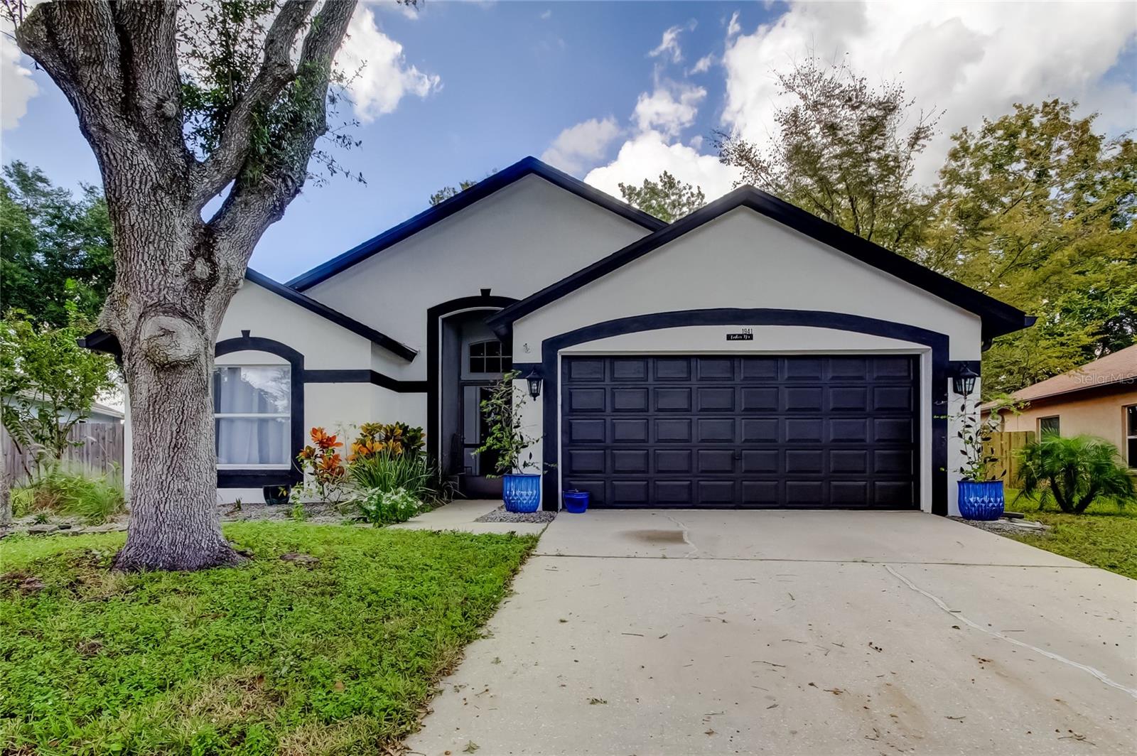 Charming 3-bedroom, 2-bathhome located in the desirable Carpenters Run community of Lutz. This beautifully maintained property features an open floor plan and vaulted ceilings that create a spacious, inviting atmosphere. The well-appointed eat-in kitchen includes a breakfast bar, perfect for casual dining. Sliding glass doors open to a stunning screened patio, ideal for relaxing or entertaining guests. The primary suite offers dual sinks, a walk-in closet, and plenty of natural light. Enjoy the beautifully landscaped backyard and the community amenities, including a pool, clubhouse, and playground. Don’t miss the opportunity to make this exceptional home your own—schedule your private showing. " Can You See Yourself Living Here"