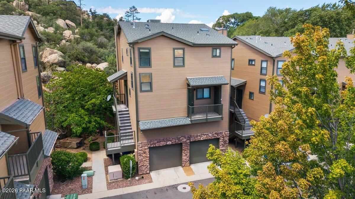 Good news! The owners are selling and it's your opportunity to get a great home in the gated community of Boulder Park Townhomes. Located close to shopping, local restaurants and all that Prescott has to offer. Just off Iron Springs and Gail Gardner, this stand alone unit has so much to offer. Main level has new vinyl flooring in the living room and the kitchen has brand new stainless steel appliances! Fresh paint throughout, plus a brand new water heater...this is truly move-in ready! Two ensuites upstairs, with balcony off the primary bedroom, giving you a peaceful place to just sit and enjoy the boulders and trees that make this place so special. Two more decks on the second level for additional outdoor living space. There is over 200 sq ft of living space downstairs with a full bath, heated and cooled with a wall unit. It has it's own separate entrance, so perfect for a college student or guests. Great getaway from the heat of Phoenix or as an investment property.
