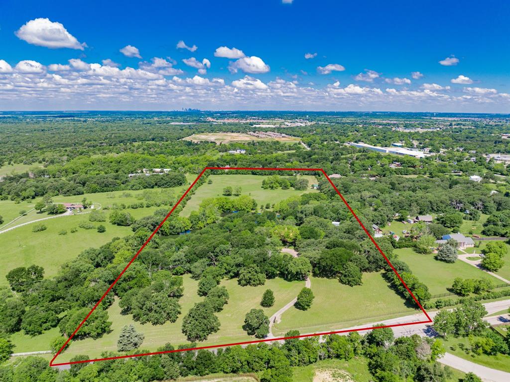 Stunning 19+ Acre Estate Just 20 Minutes from Dallas
Discover a rare gem nestled just southeast of Dallas—19+ beautifully manicured acres featuring two tranquil, stocked ponds, and a canopy of majestic trees, including live oaks, elms, post oaks, and pecans. This exceptional property offers a harmonious blend of natural beauty and refined living. Fully sodded yard with water views, lush landscaping, and irrigation system sourced from ponds.
The main residence boasts 4 spacious bedrooms and 3 full baths and 2 half baths, with each bedroom enjoying direct access to a private or shared bath, including a Jack-and-Jill setup. Work from home in the private office nook in the primary suite. Tons of storage throughout, with walk-in closets in every bedroom, a spacious cedar walk-in closet upstairs, and a large walk-in attic for additional storage. Multiple living areas provide room to relax or entertain, anchored by a striking wood-burning fireplace crafted from authentic Chicago brick.
The home is crowned with a metal copper roof finished in Firestone, adding both elegance and durability. Enjoy unforgettable moments in the architecturally stunning great room, including a wet bar and half bath, complete with a private balcony overlooking the ponds and expansive yard.
For the hobbyist or car enthusiast, the estate includes additional 6-car garages including RV storage. Plus, guests will feel right at home in the 1,200 sq ft guest house, featuring its own private, gated entrance. The property also includes a 3-stall chain-link dog kennel, perfect for pet owners or hobby breeders. And with plenty of open land, bring your horses or livestock to complete your dream ranch lifestyle.
This property must be seen to truly appreciate its charm, craftsmanship, and serenity. A perfect combination of luxury, comfort, and country living—just minutes from the city.