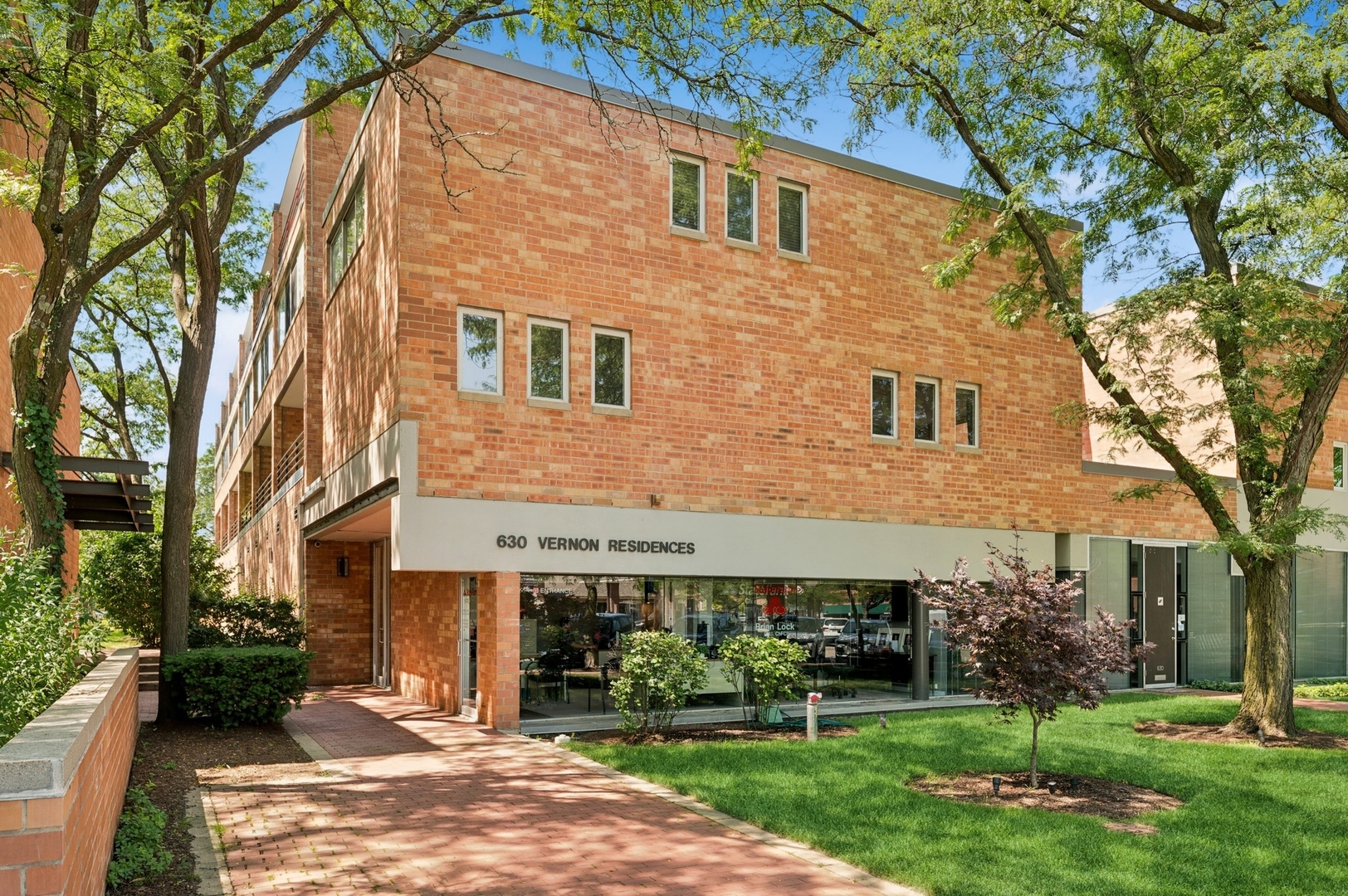Welcome to 630 Vernon Ave, Glencoe!  A  two-bedroom, two-bath multi floor condo that feels like a home in a modern elevator building. Downtown Glencoe is a charming blend of quaint shops, popular eateries, beautiful tree lined streets and a stones throw away from the gorgeous shores of Lake Michigan, all in the New Trier School district. Includes 2 garage spots with an EV Charger in the heated garage. Renovated from top to bottom by one of Chicago's preeminent Architects, boasts a rich history as their former home. every detail has been meticulously reimagined, featuring top of the line upgrades and exquisite finishes throughout. This  property boasts a modern open floor plan, an expansive kitchen with a huge island that is open to the gorgeous sun drenched living area featuring hardwood flooring and  modern finishes that include granite kitchen counter tops and backsplash, stainless steel appliances, marble and stone bathrooms, in unit digital/Wifi enabled washer and dryer. This property offers a gorgeous balcony for grilling  overlooking the courtyard and inviting outdoor space. Some additional upgrades include, recently painted, high end dishwasher, gorgeous blinds, digital thermostat, newer entry hardware with entry digital lock, and upgraded balcony. Walking distance to the vibrant atmosphere of downtown Glencoe, where you'll find an array of delightful shops and enticing restaurants, perfect for dining and shopping just moments away. Surrounded by the lush parks and Beaches, in the area for picnics, walks, and outdoor activities. This condo is not just a residence; it's a lifestyle! Don't miss your chance to embrace the best of suburban living, near the beach, picturesque parks, and the charm of downtown Glencoe right at your doorstep. Schedule a showing today!